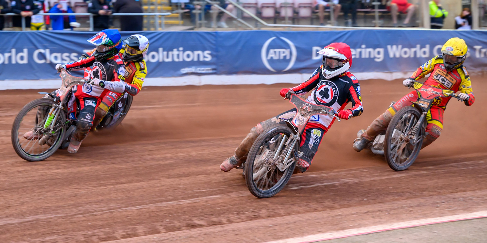 William Cairns of Belle Vue Aces in Blue and Peter Kildemand of Belle Vue Aces in Red leading Ryan Douglas of Leicester Lions in White and Kyle Howarth of Leicester Lions in Yellow during the Rowe Motor Oil Premiership match between Belle Vue Aces and Leicester Lions at the National Speedway Stadium, Manchester on Monday 15th June 2026. (Photo: Ian Charles | MI News)
