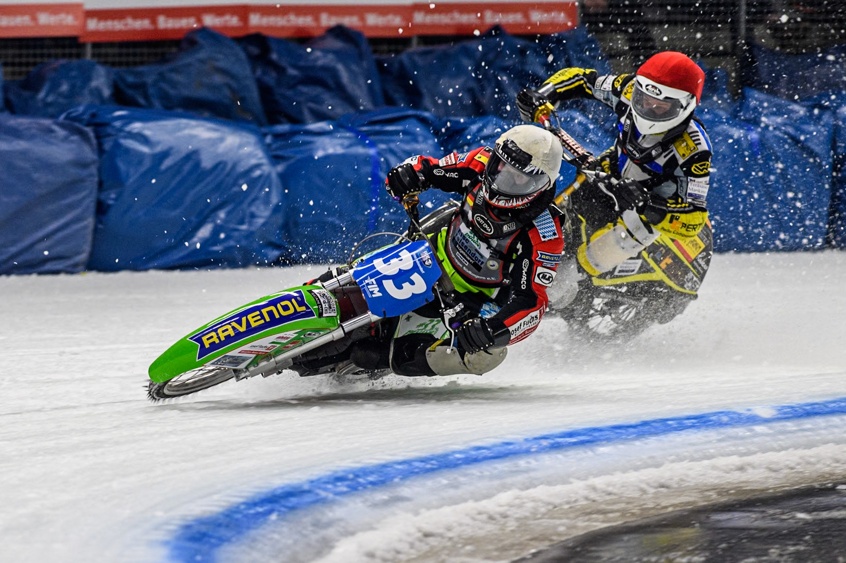 Germany's Johann Weber (33) (White) leads  Finland's Heikki Huusko (67) (Red) during the FIM Ice Speedway Gladiators World Championship Final 1 at the Max-Aicher-Arena, Inzell on Saturday 23 March 2024. (Photo: Ian Charles | MI News)