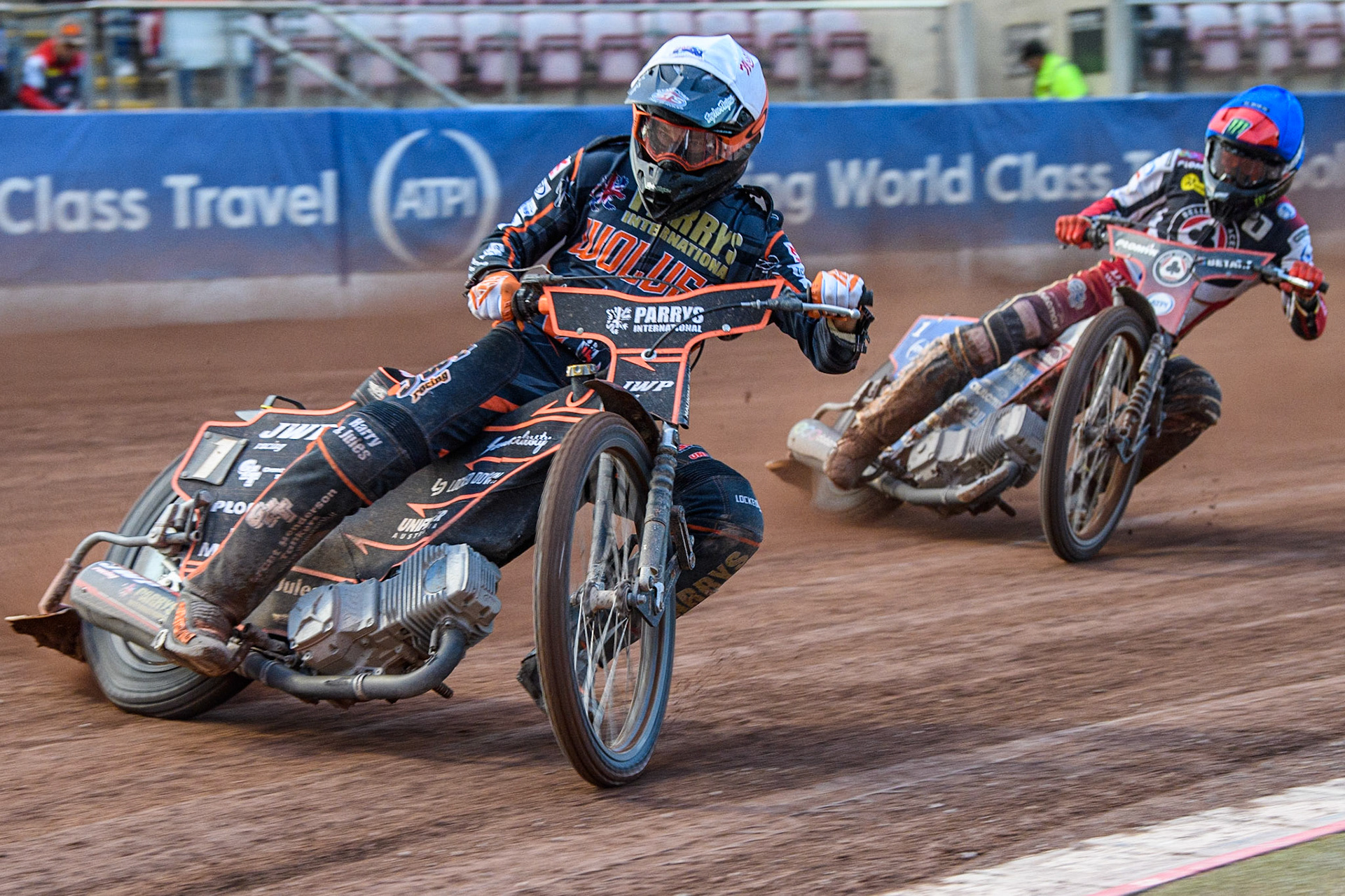 Sam Masters (White) leads Dan Bewley (Blue) during the Sports Insure Premiership match between Belle Vue Aces and Wolverhampton Wolves at the National Speedway Stadium, Manchester on Monday 3rd July 2023. (Photo: Ian Charles | MI News)