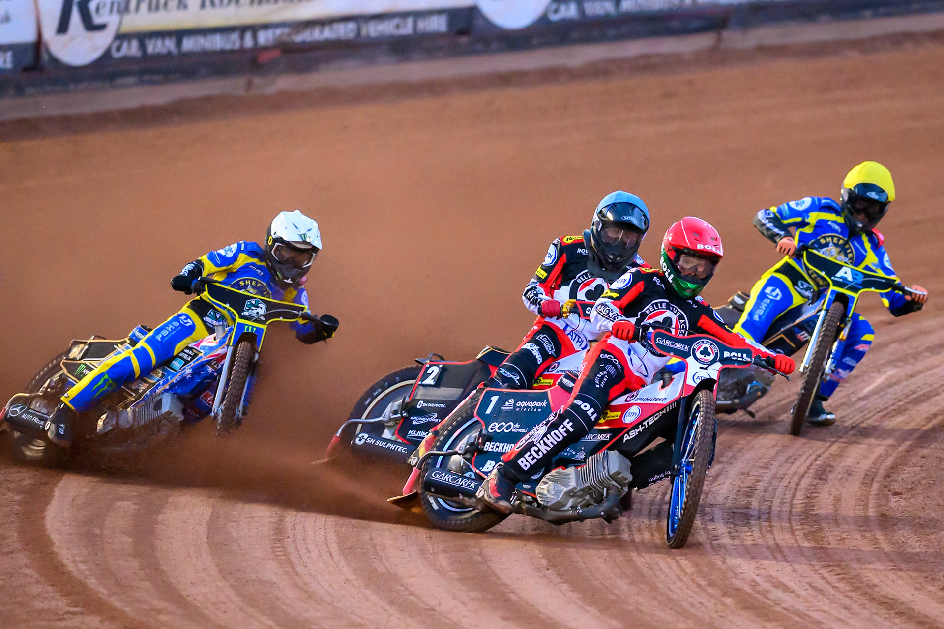 Brady Kurtz of Belle Vue Aces in Red leading Norick Blodorn of Belle Vue Aces  in Blue Jack Holder of Sheffield Tigers   in White and Anders Rowe of Sheffield Tigers    in Yellow during the Knockout Cup, Northern Section match between Belle Vue Aces and Sheffield Tigers at the National Speedway Stadium, Manchester on Monday 30th March 2026. (Photo: Ian Charles | MI News)