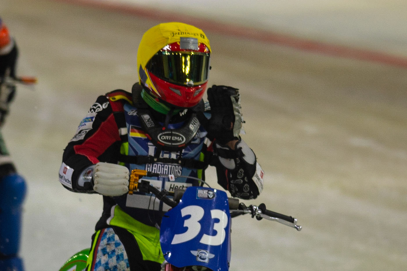 HEERENVEEN, NL.Johann Weber (33)  waves to the fans after his win in Heat 9  during the FIM Ice Speedway Gladiators World Championship Final 3 at Ice Rink Thialf, Heerenveen on Saturday  2 April 2022. (Credit: Ian Charles | MI News)