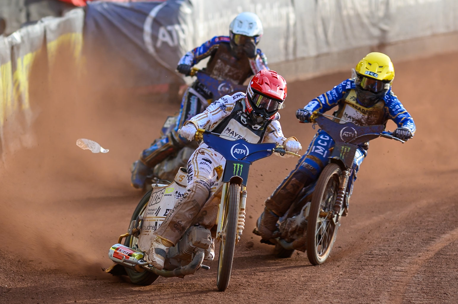 Anders Thomsen (105) of Denmark in Red rides outside Bartosz Zmarzlik (95) of Poland in Yellow with Jason Doyle (69) of Australia in White behind during the ATPI  FIM Speedway GP of Manchester at the National Speedway Stadium, Manchester on Friday 5th June 2026. (Photo: Ian Charles | MI News)