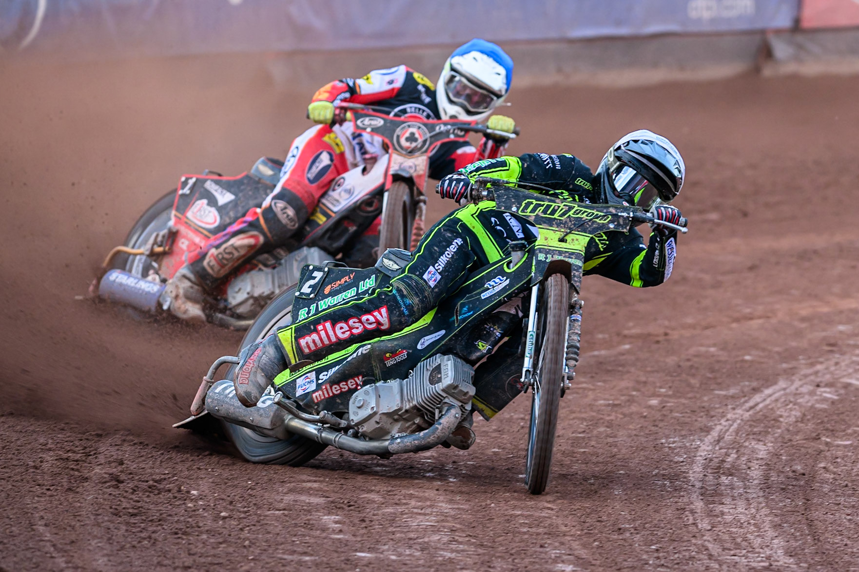 Ipswich Witches' Danny King in White leading Belle Vue Aces' Jake Mulford  in Blue during the Rowe Motor Oil Premiership match between Belle Vue Aces and Ipswich Witches at the National Speedway Stadium, Manchester on Monday 30th June 2025. (Photo: Ian Charles | MI News)