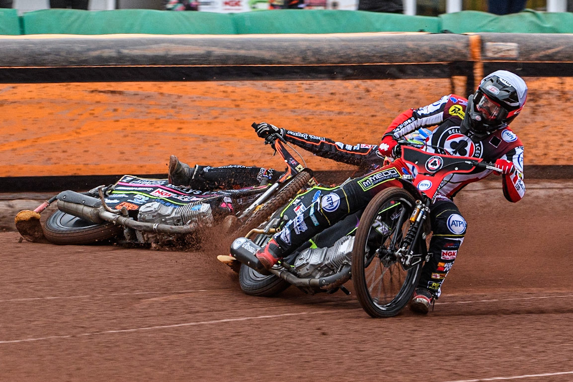 Tom Brennan (White) inside Leon Flint (Blue) as he falls in the first bend during the Sports Insure Premiership match between Wolverhampton Wolves and Belle Vue Aces at Monmore Green Stadium, Wolverhampton on Monday 10th July 2023. (Photo: Ian Charles | MI News)