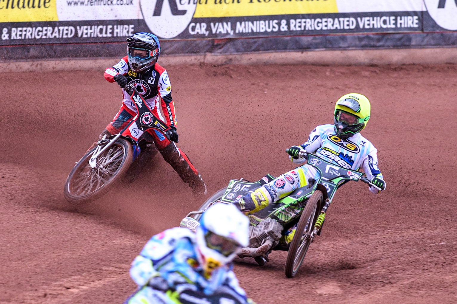 Belle Vue Aces' Ben Cook in Blue loses control after a tangle with Oxford Spires' Charles Wright in Yellow during the Rowe Motor Oil Premiership match between Belle Vue Aces and Oxford Spires at the National Speedway Stadium, Manchester on Monday 22nd July 2024. (Photo: Ian Charles | MI News)