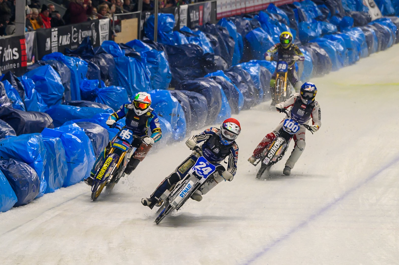 Max Koivula (24) of Finland in Red leading the last Chance Heat from Luca Bauer (85) of Italy/Germany in White, Franz Zorn (100) of Austria in Blue and Max Niedermaier (88) of Germany in Yellow during the Ice Speedway Gladiators World Championship Final 2 at Max-Aicher-Arena, Inzell on Sunday 15th March 2026. (Photo: Ian Charles | MI News)