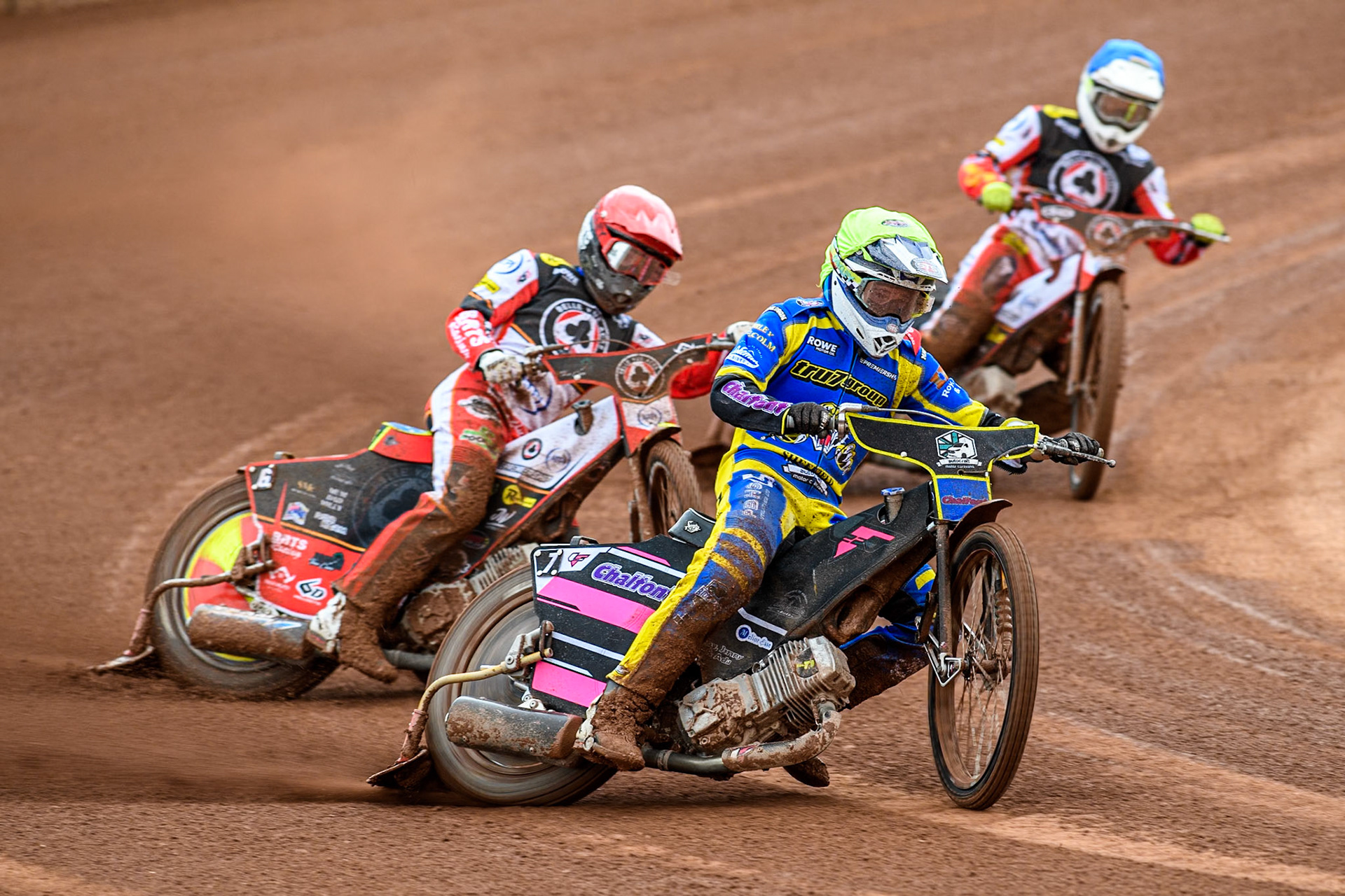Leon Flint of Sheffield Tigers in Yellow leading Tate Zischke of Belle Vue Aces in Red and Jake Mulford of Belle Vue Aces in Blue during the Rowe Motor Oil Premiership match between Belle Vue Aces and Sheffield Tigers at the National Speedway Stadium, Manchester on Monday 5th May 2025. (Photo: Ian Charles | MI News)