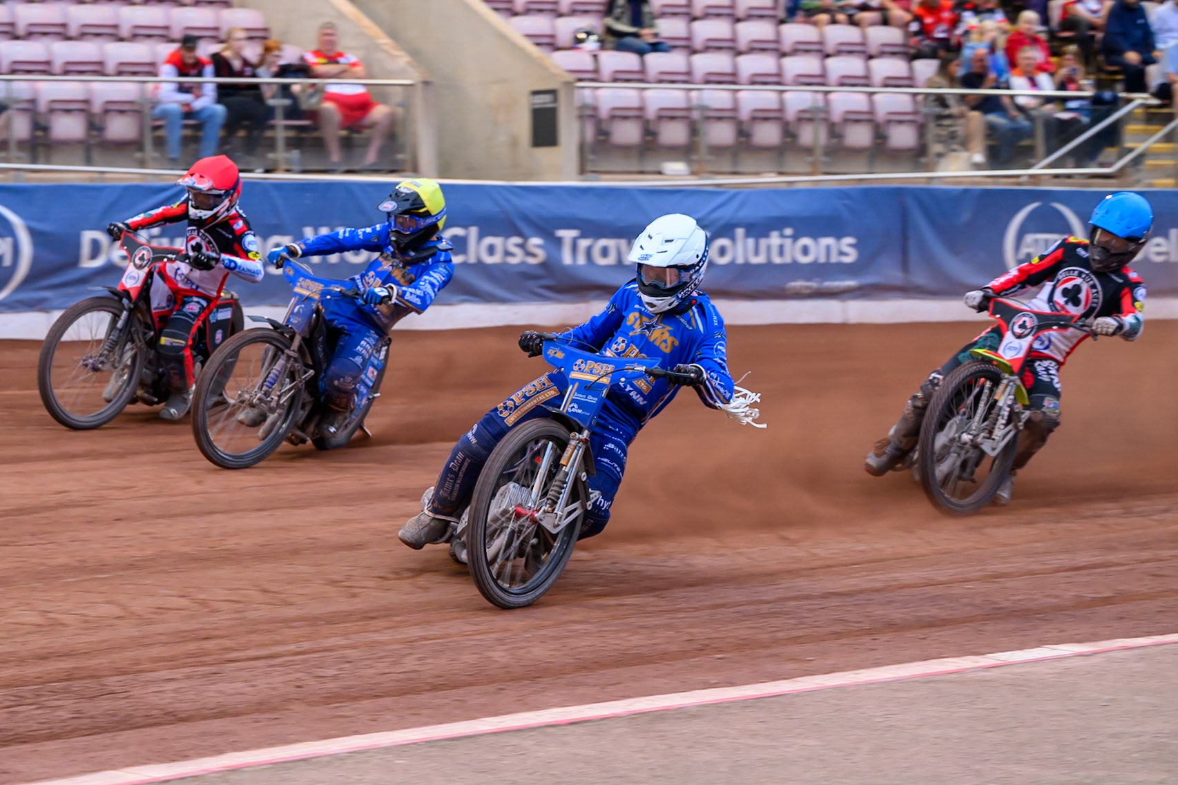 Cooper Rushen of Kings Lynn Stars in White rides inside Jody Scott of Kings Lynn Stars in Yellow and Zach Cook of Belle Vue Aces in Red  with Tate Zischke of Belle Vue Aces in Blue behind during the Rowe Motor Oil Premiership match between Belle Vue Aces and King's Lynn Stars at the National Speedway Stadium, Manchester on Monday 29th June 2026. (Photo: Ian Charles | MI News)