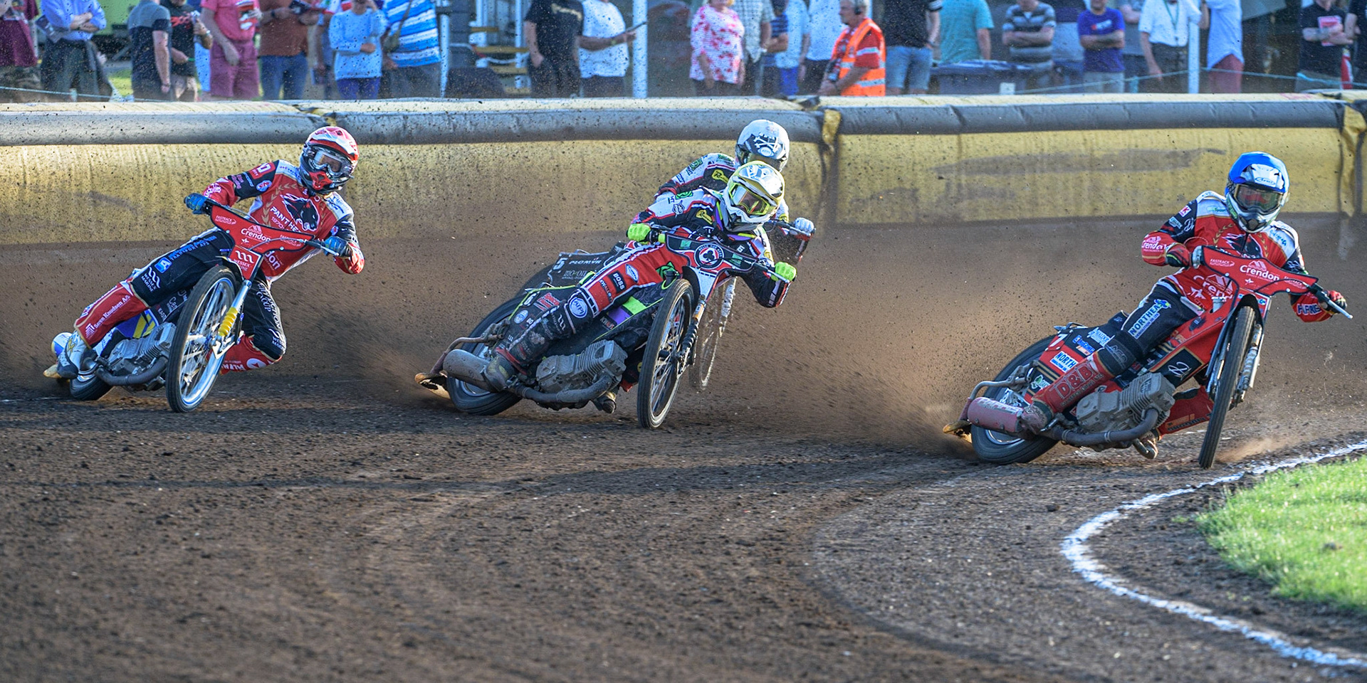 PETERBOROUGH, UK. JULY 19TH  Tom Brennan   (Yellow) triers to split Bjarne Pedersen  (Red) and Chris Harris (Blue) with Dan Bewley  (White) behind during the SGB Premiership match between Peterborough and Belle Vue Aces at East of England Showground, Peterborough on Monday 19th July 2021. (Credit: Ian Charles | MI News)