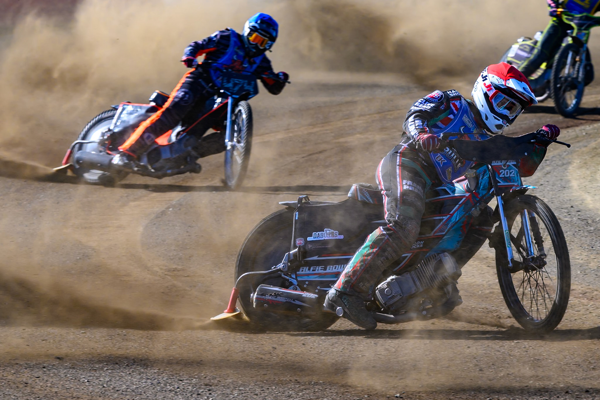 Alfie Bowtell of Buxton Bulls in Red leading Jack Roberts of Buxton Bulls in Blue and Ben Whalley of Edinburgh Monarchs Academy in Yellow during the WSRA National Development League match between Buxton Bulls and Edinburgh Monarchs Academy at Hi-Edge Speedway, Buxton on Sunday 14th June 2026. (Photo: Ian Charles | MI News)