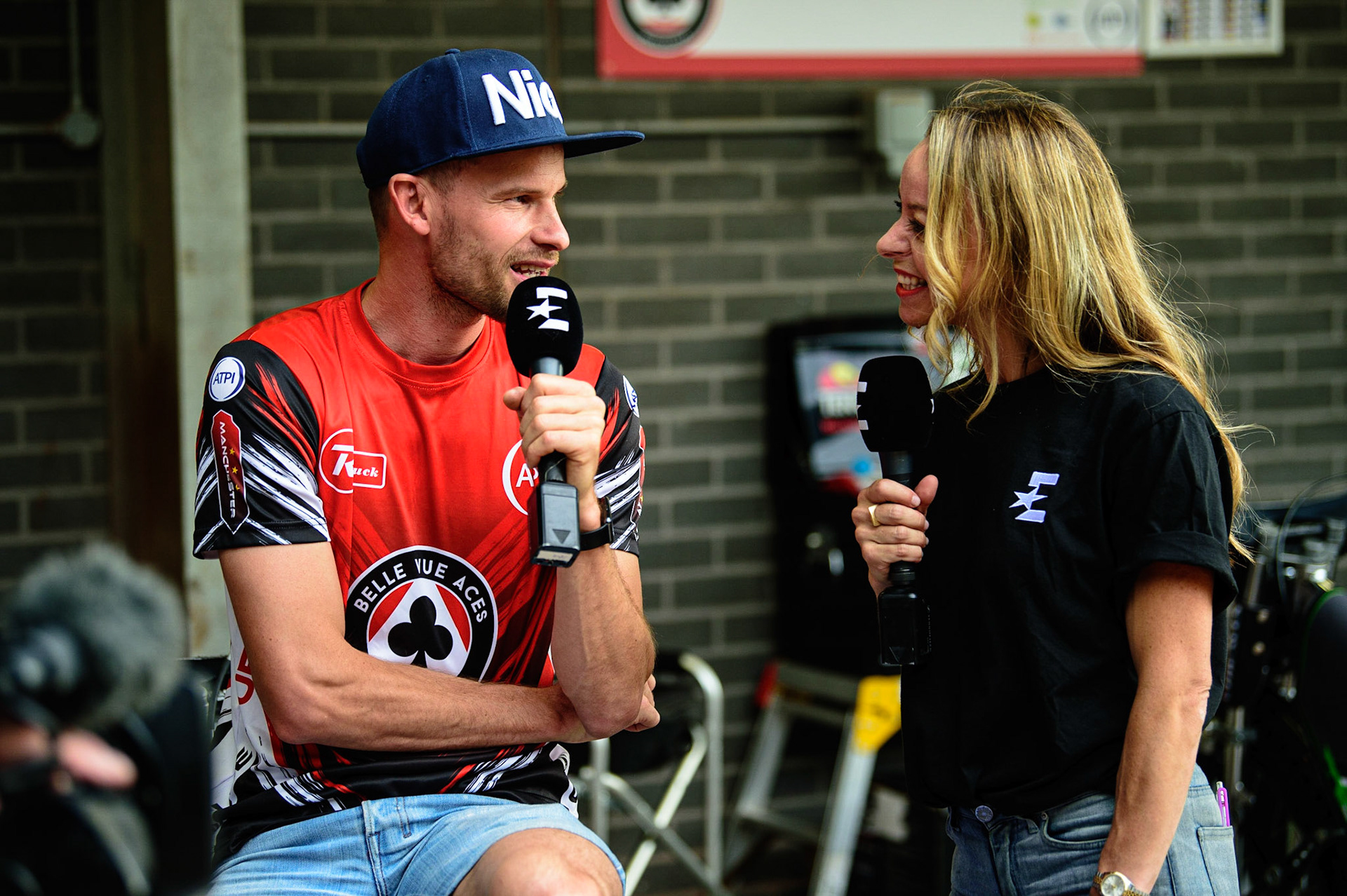 MANCHESTER UK  Belle Vue ATPI Aces rider Matej Zagar  (left) is interviewed by Eurosport presenter Abi Stephens during the SGB Premiership match between Belle Vue Aces and King's Lynn Stars at the National Speedway Stadium, Manchester on Monday 11th July 2022. (Credit: Ian Charles | MI News)