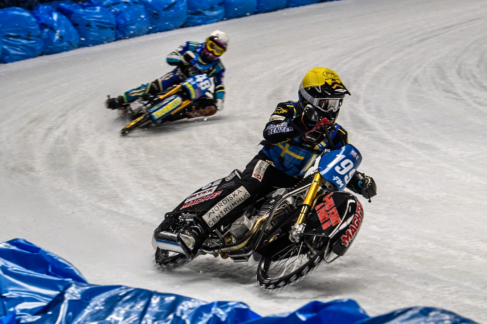 Martin Haarahiltunen (199) of Sweden in Yellow leading Luca Bauer (48) of Germany in White during the Ice Speedway Gladiators World Championship Final 1 at Max-Aicher-Arena, Inzell on Saturday 15th March 2025. (Photo: Ian Charles | MI News)