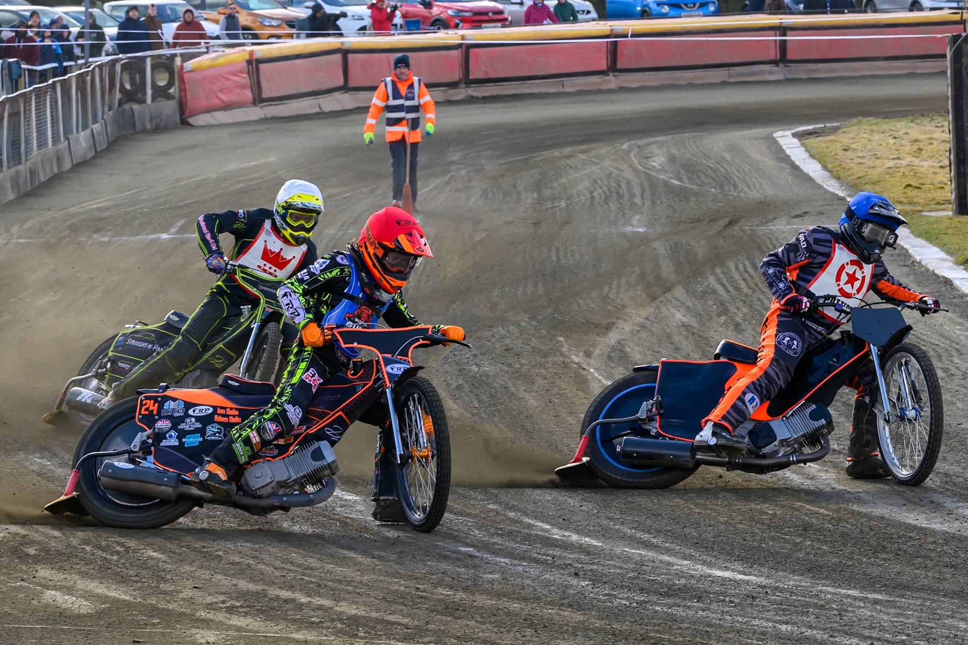 Jack Smith of Buxton Bulls  in Red rides outside Jack Roberts of 'The Potters'  in Blue with Ben Whalley of 'The Kings'  behind during the Regina Chains Fours at Buxton Speedway, Buxton on Sunday 5th April 2026. (Photo: Ian Charles | MI News)