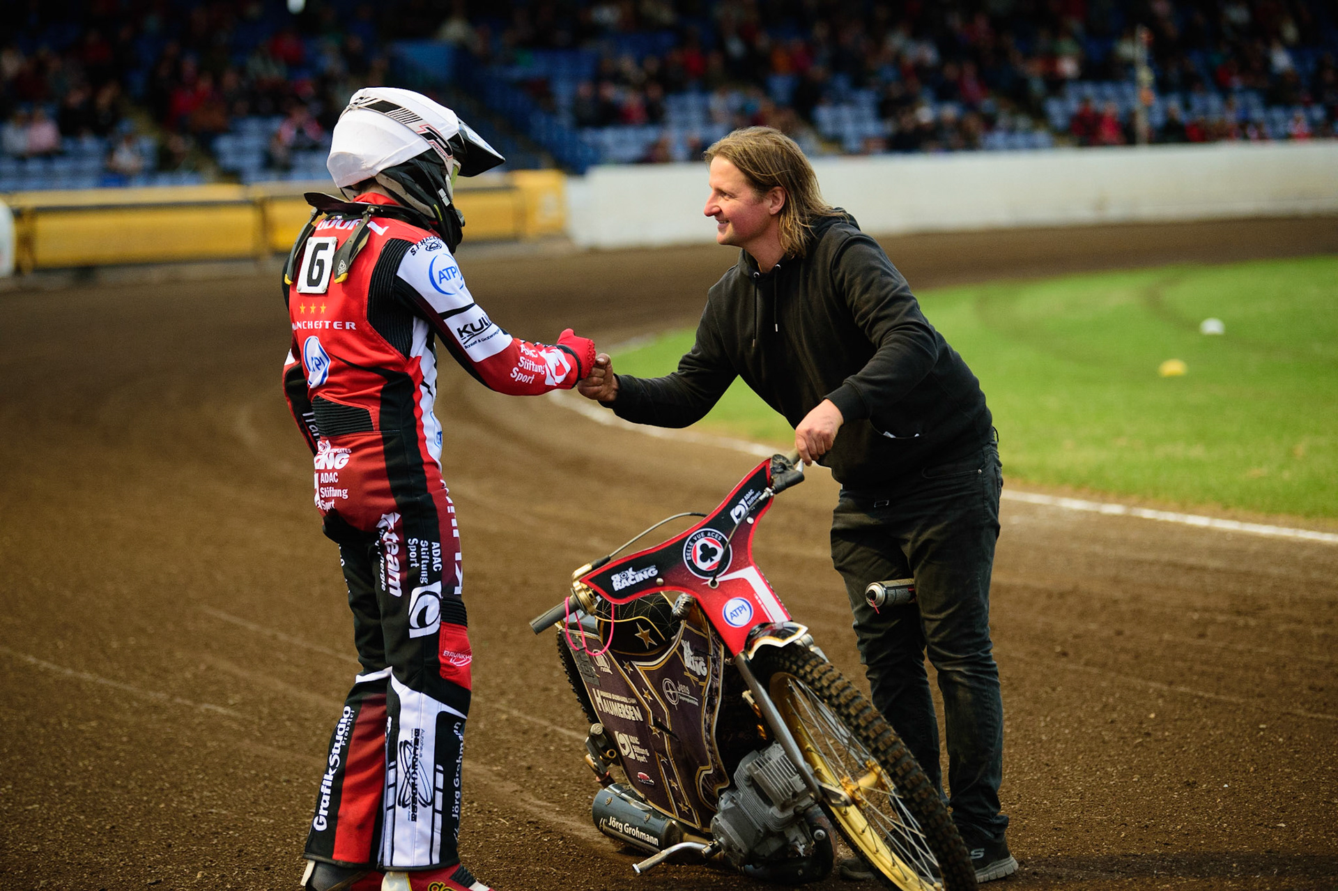 PETERBOROUGH, UK. MAY 9TH  Norick Blödorn (left) is congratulated by his mechanic Robbie Kessler, on his first heat win for Belle Vue ATPI Aces  during the SGB Premiership match between Peterborough Panthers and Belle Vue Aces at East of England Showground, Peterborough on Monday 9th May 2022. (Credit: Ian Charles | MI News)
