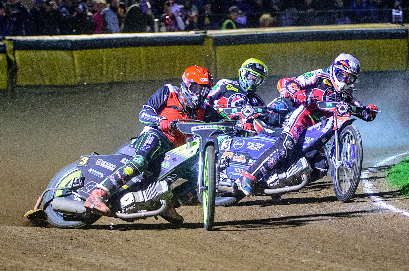 PETERBOROUGH, UK. OCT 14TH Craig Cook (Red) leads Steve Worrall   (White) and Charles Wright  (Yellow) during the SGB Premiership Grand Final 2nd leg between Peterborough and Belle Vue Aces at East of England Showground, Peterborough on Thursday 14th October 2021. (Credit: Ian Charles | MI News)
