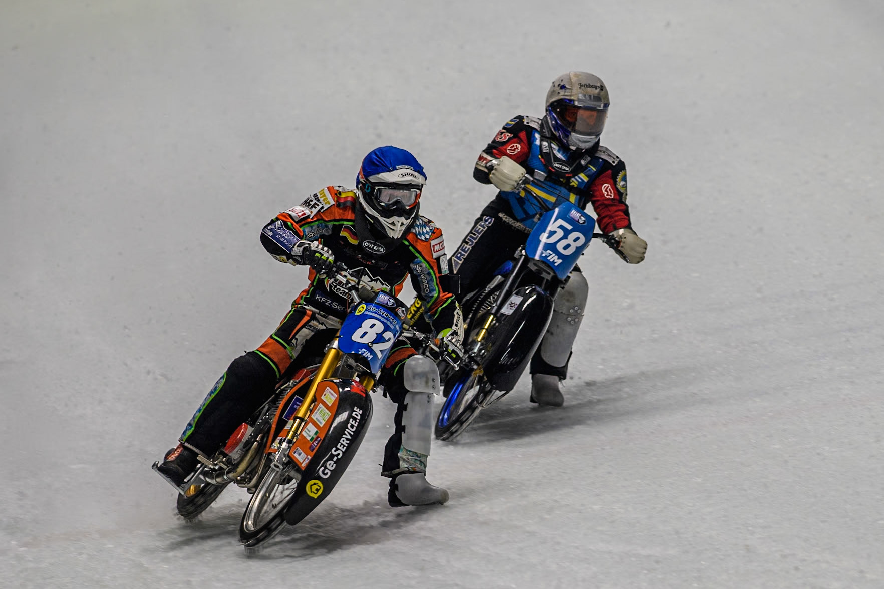 Germany's Markus Jell (82) (Blue) leads  Sweden's Stefan Svensson (58) (White) during the FIM Ice Speedway Gladiators World Championship Final 1 at the Max-Aicher-Arena, Inzell on Saturday 23 March 2024. (Photo: Ian Charles | MI News)