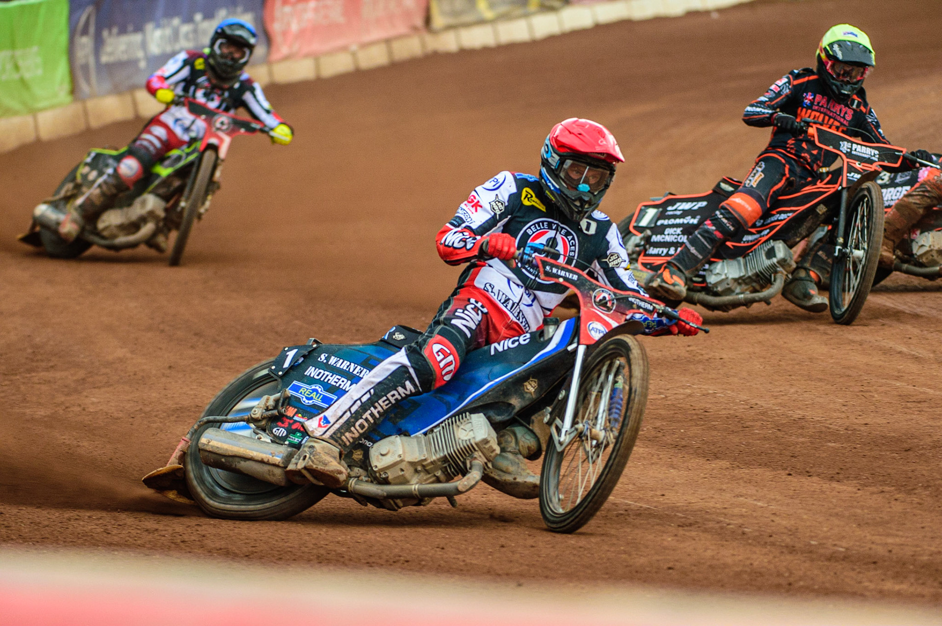 Matej Zagar  (Red) leads Tom Brennan  (Blue) and Sam Masters (Yellow) during the SGB Premiership match between Belle Vue Aces and Wolverhampton Wolves at the National Speedway Stadium, Manchester on Monday 29th August 2022. (Credit: Ian Charles | MI News)