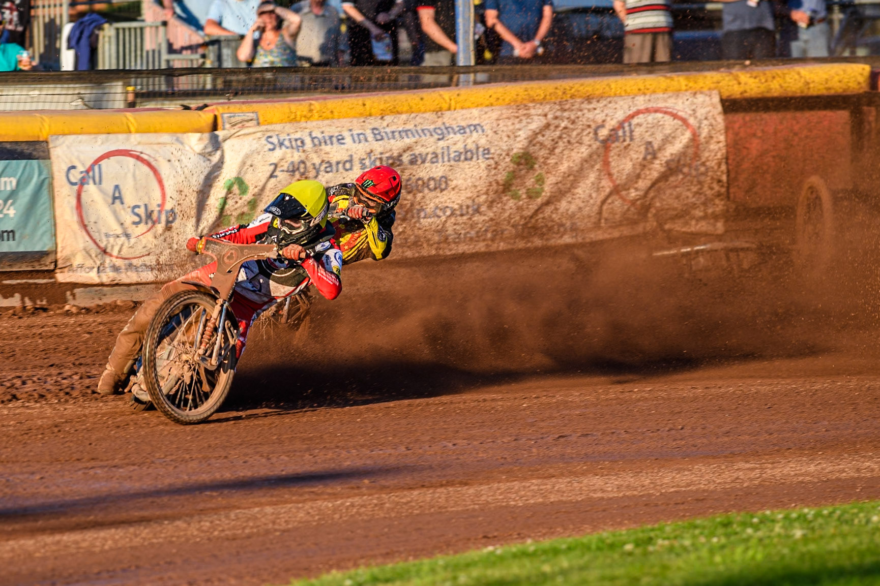 Belle Vue Aces' Brady Kurtz falls again in the rerun of Heat 1 on the first turn behind Belle Vue Aces' Norick Blodorn in Yellow and Birmingham Brummies' Freddie Lindgren in Red during the Rowe Motor Oil Premiership match between Birmingham Brummies and Belle Vue Aces at Perry Bar Stadium, Birmingham on Monday 29th July 2024. (Photo: Ian Charles | MI News)