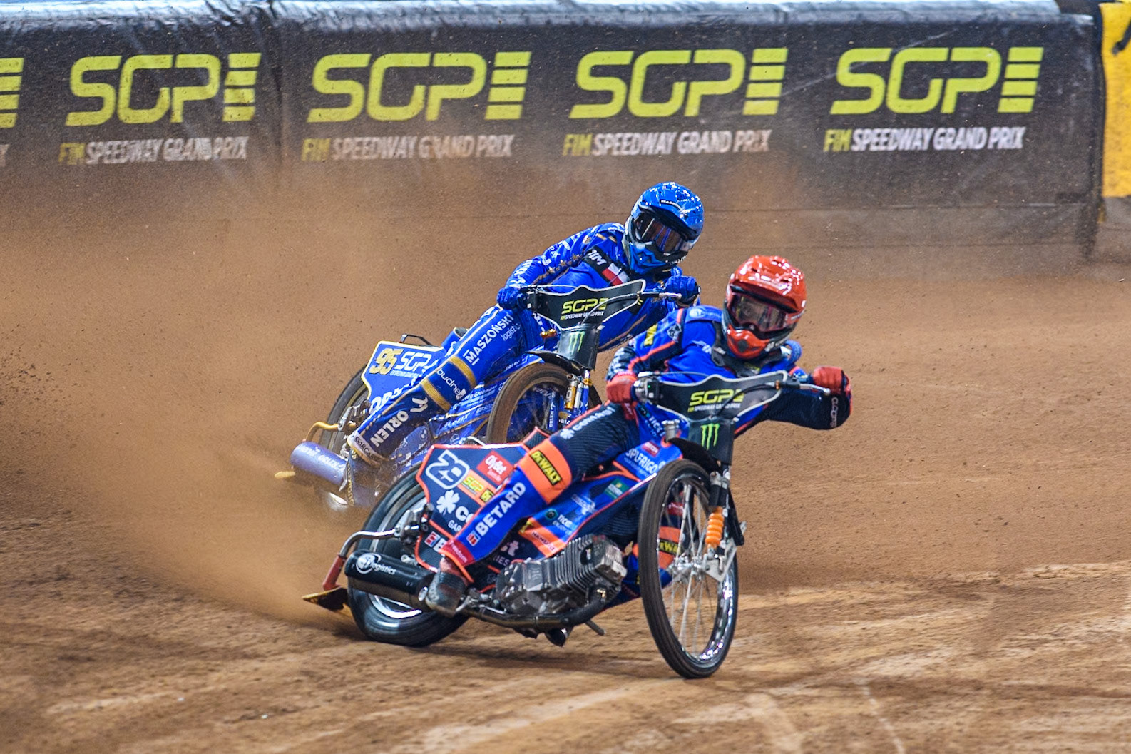 Andzejs Lebedevs (29) of Latvia in Red leading Bartosz Zmarzlik (95) of Poland  in Blue during the FIM Speedway Grand Prix of Great Britain at The Principality Stadium, Cardiff on Saturday 17th August 2024. (Photo: Ian Charles | MI News)