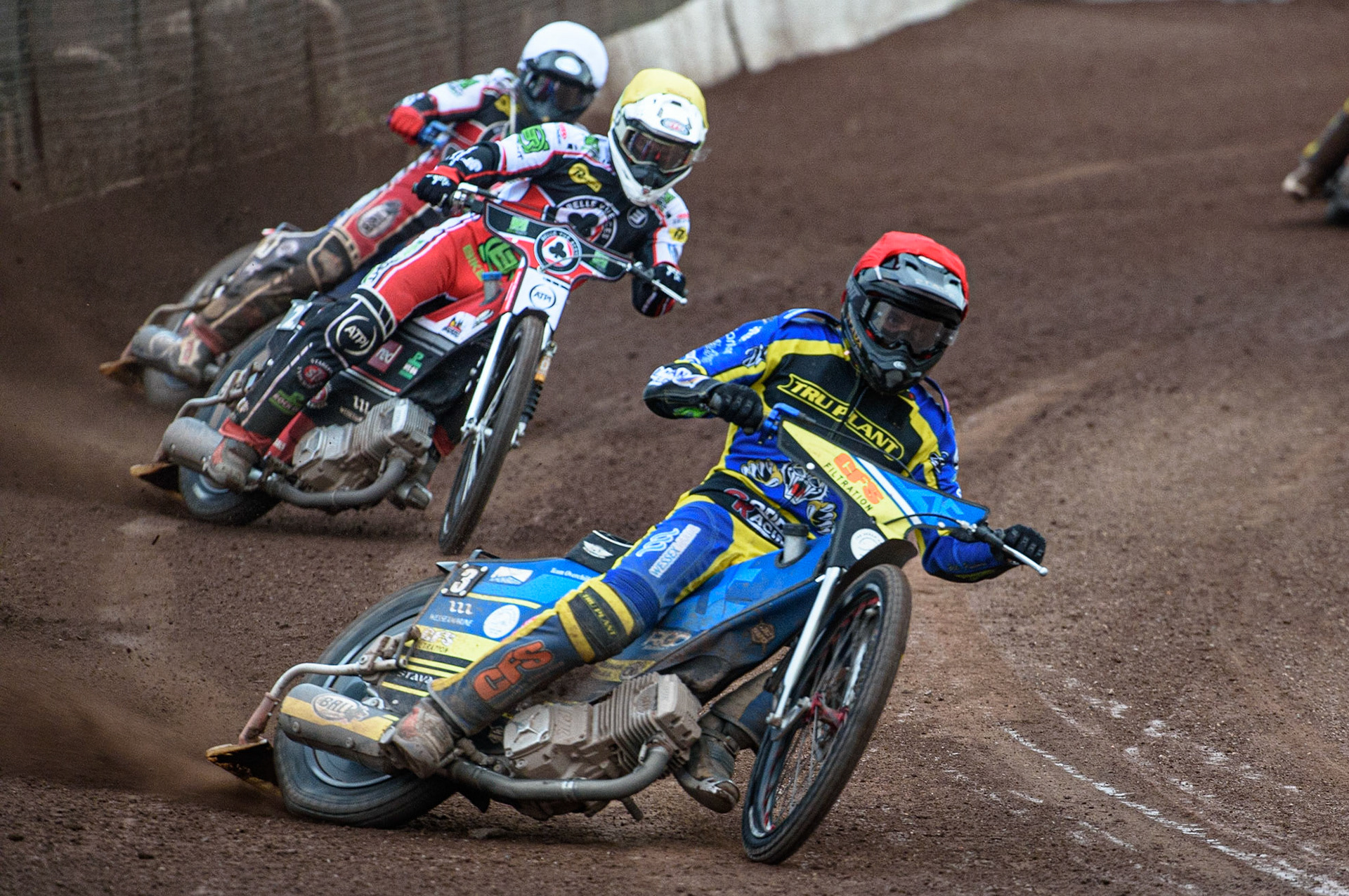 SHEFFIELD, UK. JULY 1ST     Adam Ellis  (Red) leads Richie Worrall  (Yellow) and Brady Kurtz  (White) during the SGB Premiership match between Sheffield Tigers and Belle Vue Aces at Owlerton Stadium, Sheffield on Thursday 1st July 2021. (Credit: Ian Charles | MI News)