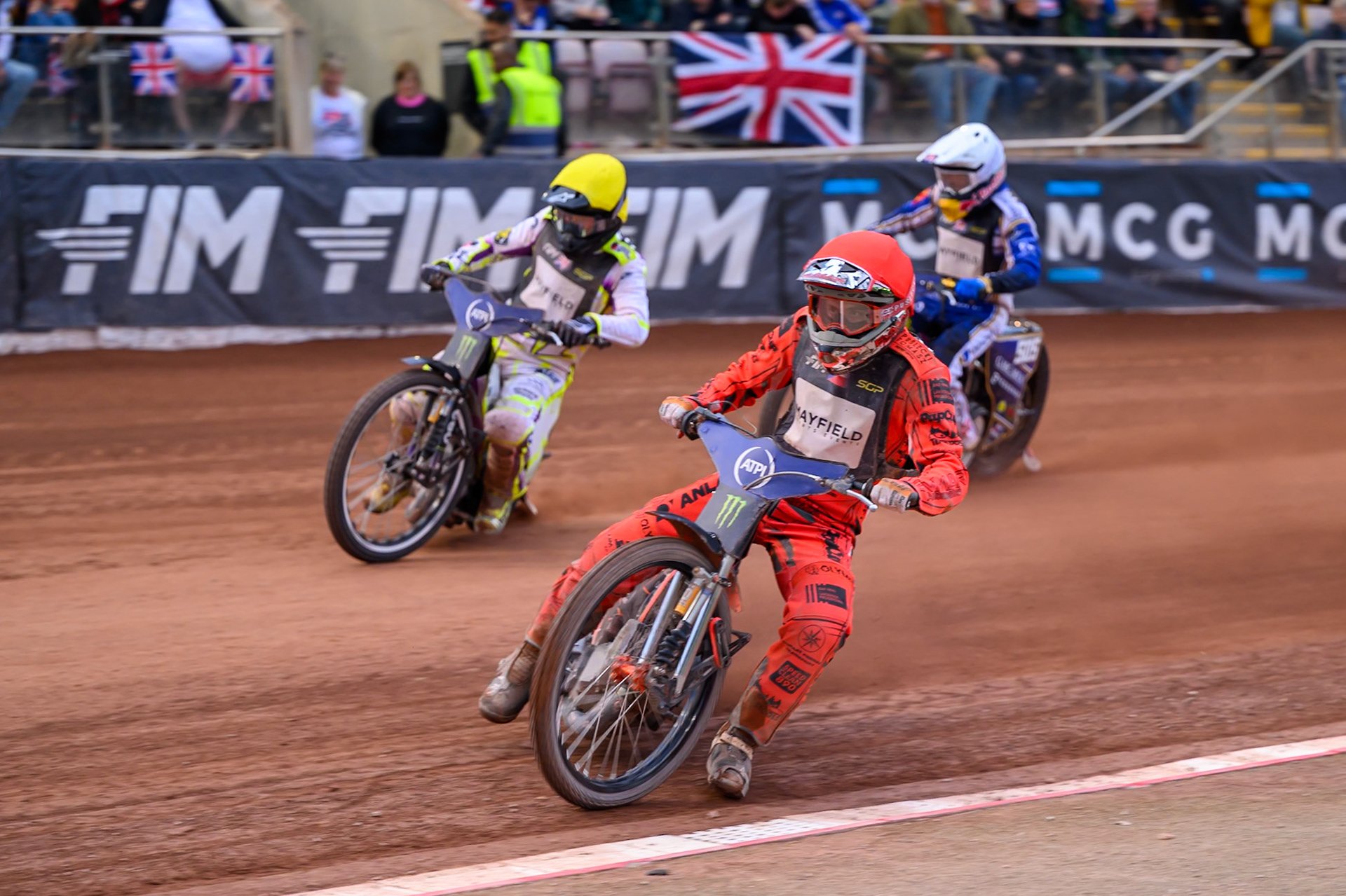 Jan Kvech (201) of Czech Republic in Red leading Wild Card Tom Brennan (16) of Great Britain in Yellow and Robert Lambert (505) of Great Britain in White during the ATPI  FIM Speedway GP of Manchester at the National Speedway Stadium, Manchester on Saturday 6th June 2026. (Photo: Ian Charles | MI News)