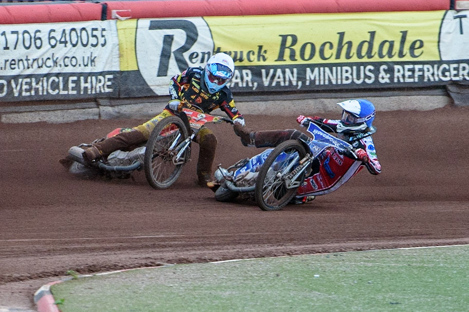 MANCHESTER, UK. JULY 29TH   Harry McGurk (Blue) picks up some drive and falls during the National Development League match between Belle Vue Colts and Leicester Lion Cubs at the National Speedway Stadium, Manchester on Thursday 29th July 2021. (Credit: Ian Charles | MI News)
