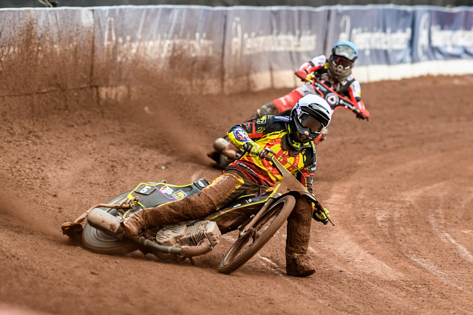 Birmingham Brummies' Tom Brennan  in White leading Belle Vue Aces' Norick Blödorn in Blue during the Rowe Motor Oil Premiership match between Belle Vue Aces and Birmingham Brummies at the National Speedway Stadium, Manchester on Monday 6th May 2024. (Photo: Ian Charles | MI News)