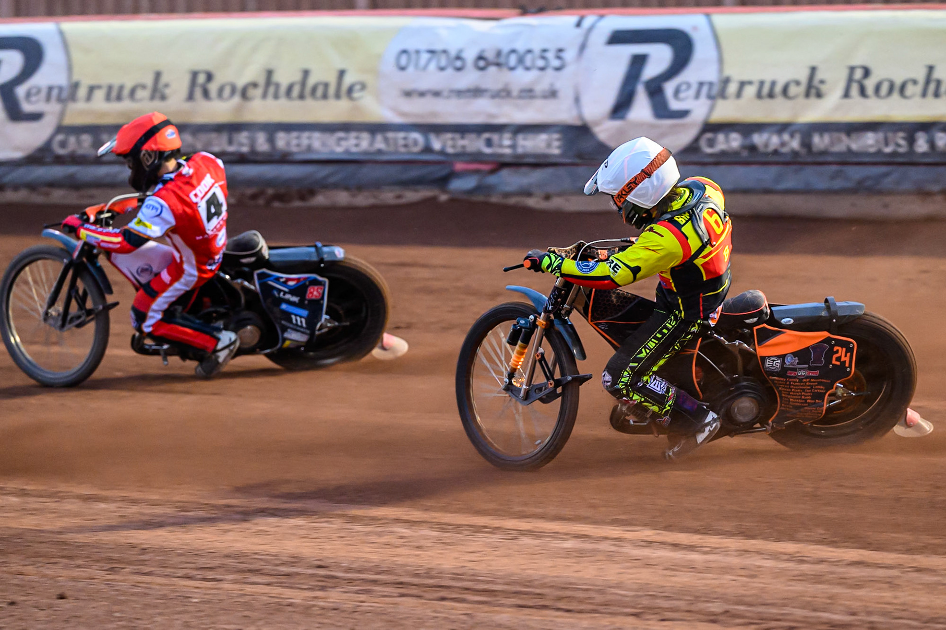 Birmingham Brummies' Guest Rider Jack Smith in White chases Belle Vue Aces' Zach Cook  in Red during the Rowe Motor Oil Premiership match between Belle Vue Aces and Birmingham Brummies at the National Speedway Stadium, Manchester on Monday 7th July 2025. (Photo: Ian Charles | MI News)