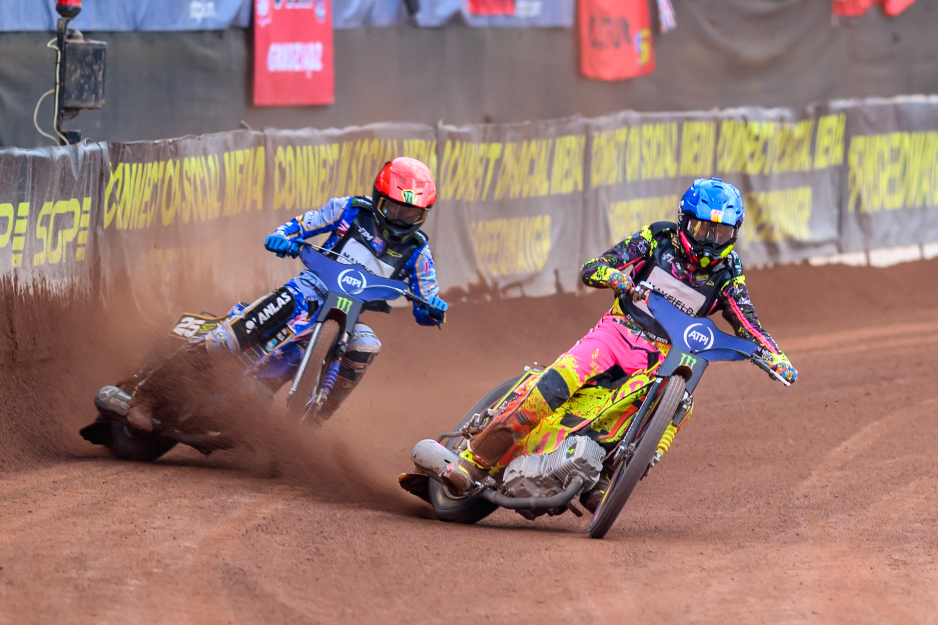 Michael Jepsen Jensen (52) of Denmark in Blue passes Jack Holder (25) of Australia in Red on the inside during the ATPI  FIM Speedway GP of Manchester at the National Speedway Stadium, Manchester on Saturday 6th June 2026. (Photo: Ian Charles | MI News)