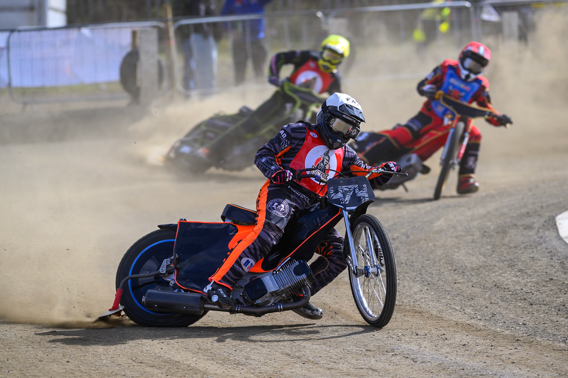 Jack Roberts of NDL Nomads in White leading Luke Harris of Buxton Bulls   in Red and Ben Whalley of NDL Nomads    in Yellow during the  Challenge match between Buxton Bulls and NDL Nomads at Hi-Edge Speedway, Buxton on Sunday 19th April 2026. (Photo: Ian Charles | MI News)