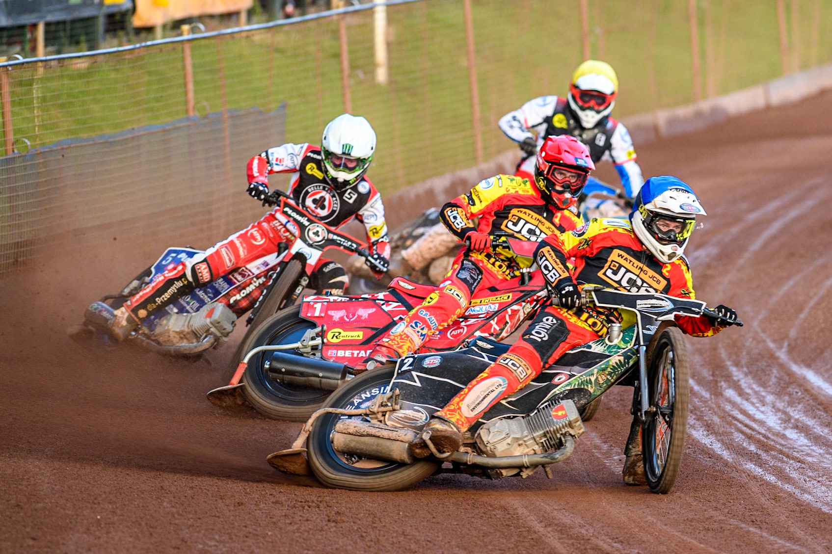 Leicester Lions' Richard Lawson in Blue leading Leicester Lions' Max Fricke in Red, Belle Vue Aces' Dan Bewley in White and Belle Vue Aces' Antti Vuolas in Yellow during the Rowe Motor Oil Premiership match between Leicester Lions and Belle Vue Aces at the Pidcock Motorcycles Arena, Leicester on Thursday 25th July 2024. (Photo: Ian Charles | MI News)