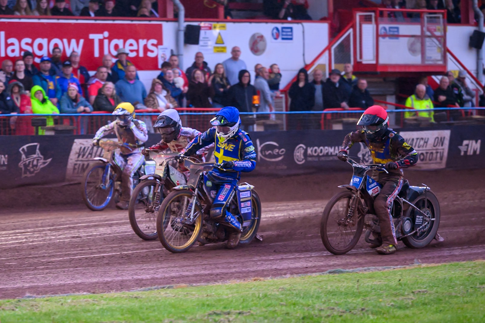 Victor Palovaara of Sweden in Blue leading Casper Henriksson of Sweden in Red Jonas Knudsen of Denmark in White and Chris Harris of Great Britain in Yellow ring the Speedway GP Qualifying Round 3 at Allied Ashfield Stadium, Glasgow on Saturday 30th May 2026. (Photo: Ian Charles | MI News)