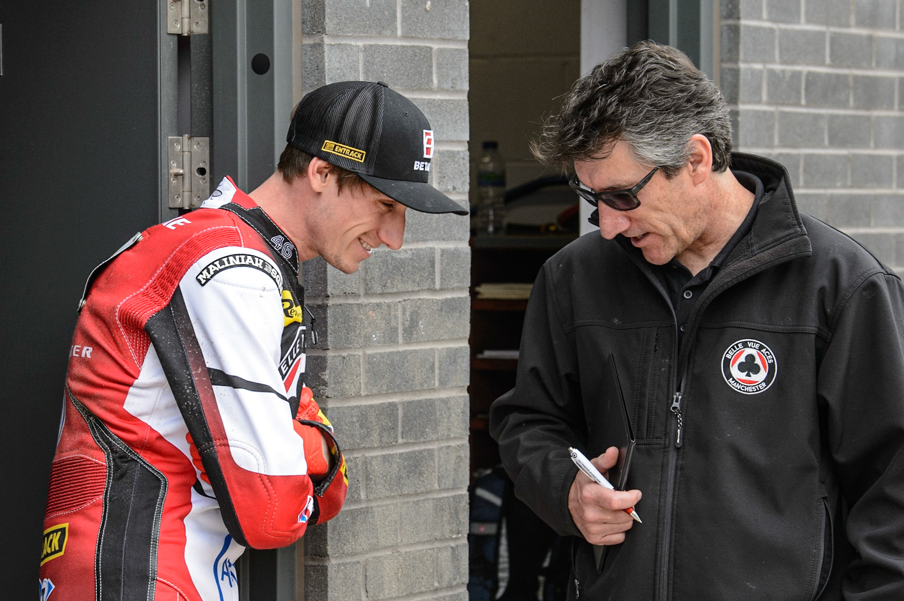 MANCHESTER, UK. MAY 2ND Max Fricke  (left) chats with Belle Vue ATPI Aces team manager Mark Lemon   during the SGB Premiership match between Belle Vue Aces and Peterborough at the National Speedway Stadium, Manchester on Monday 2nd May 2022. (Credit: Ian Charles | MI News)