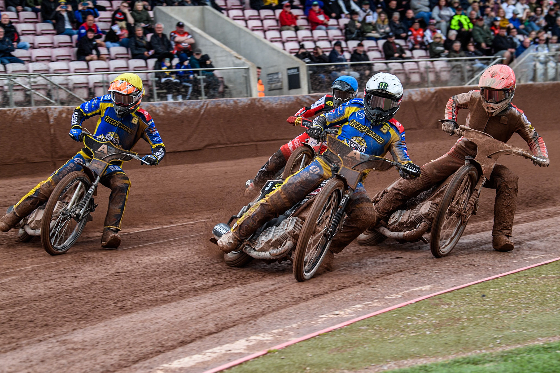 Sheffield Tigers' Tai Woffinden in White leading Belle Vue Aces' Jaimon Lidsey in Red, Sheffield Tigers' Jason Edwards in Yellow and Belle Vue Aces' Norick Blodorn in Blue during the Rowe Motor Oil Premiership match between Belle Vue Aces and Sheffield Tigers at the National Speedway Stadium, Manchester on Monday 27th May 2024. (Photo: Ian Charles | MI News)