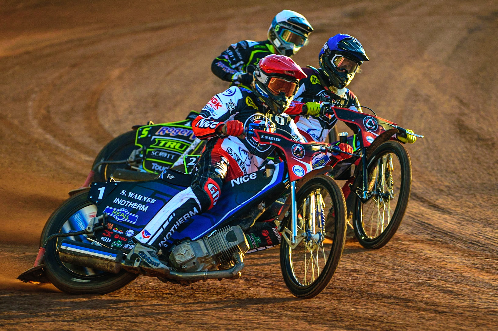 Matej Zagar  (Red) and Tom Brennan  (Blue) lead Troy Batchelor  (White) during the SGB Premiership match between Belle Vue Aces and Ipswich Witches at the National Speedway Stadium, Manchester on Monday 8th August 2022. (Credit: Ian Charles | MI News)