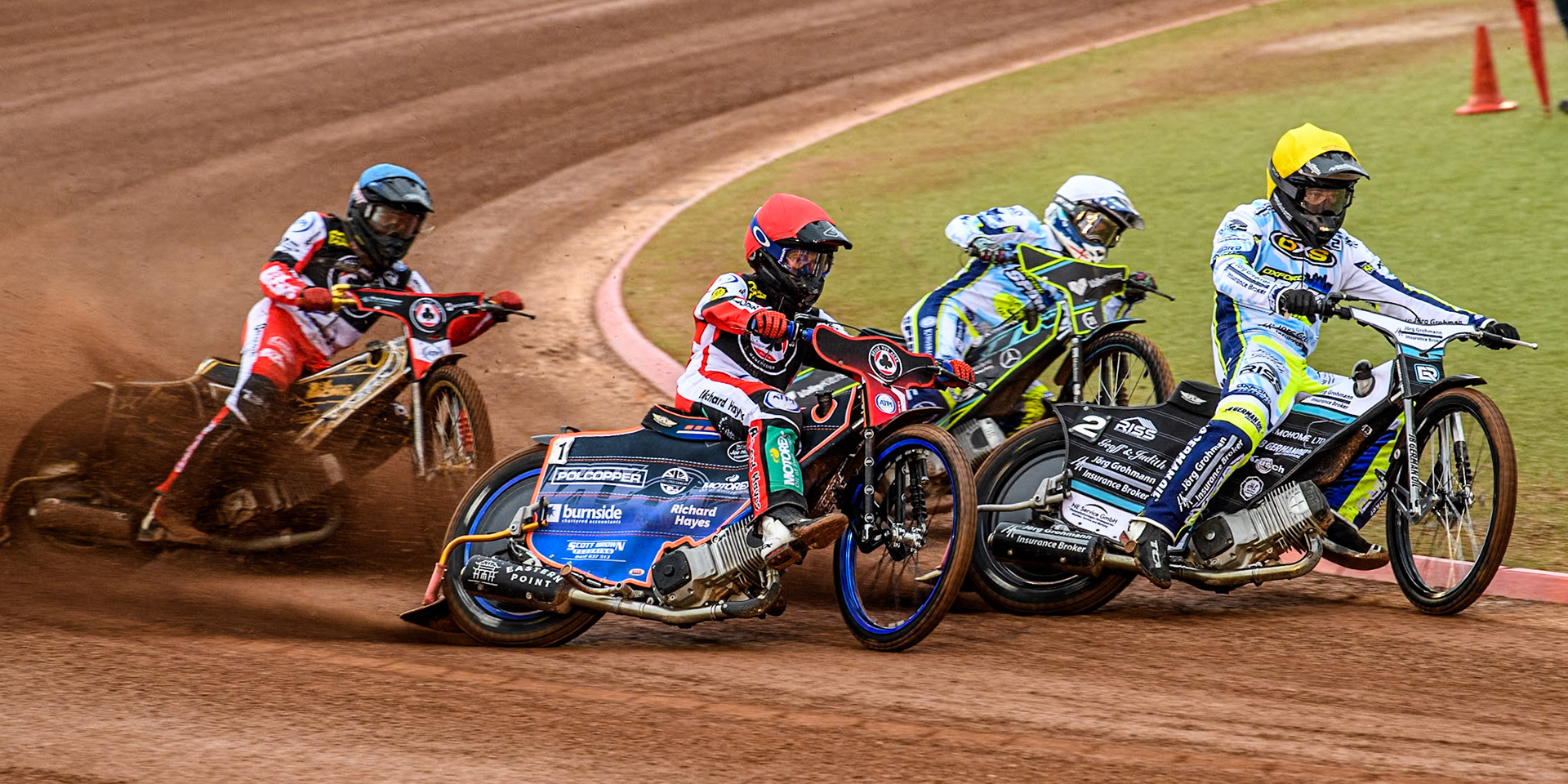 Oxford Spires' Erik Riss in Yellow leading Oxford Spires' Rohan Tungate in White, Belle Vue Aces' Brady Kurtz in Red and Belle Vue Aces' Norick Blodorn in Blue during the Rowe Motor Oil Premiership match between Belle Vue Aces and Oxford Spires at the National Speedway Stadium, Manchester on Monday 13th May 2024. (Photo: Ian Charles | MI News)