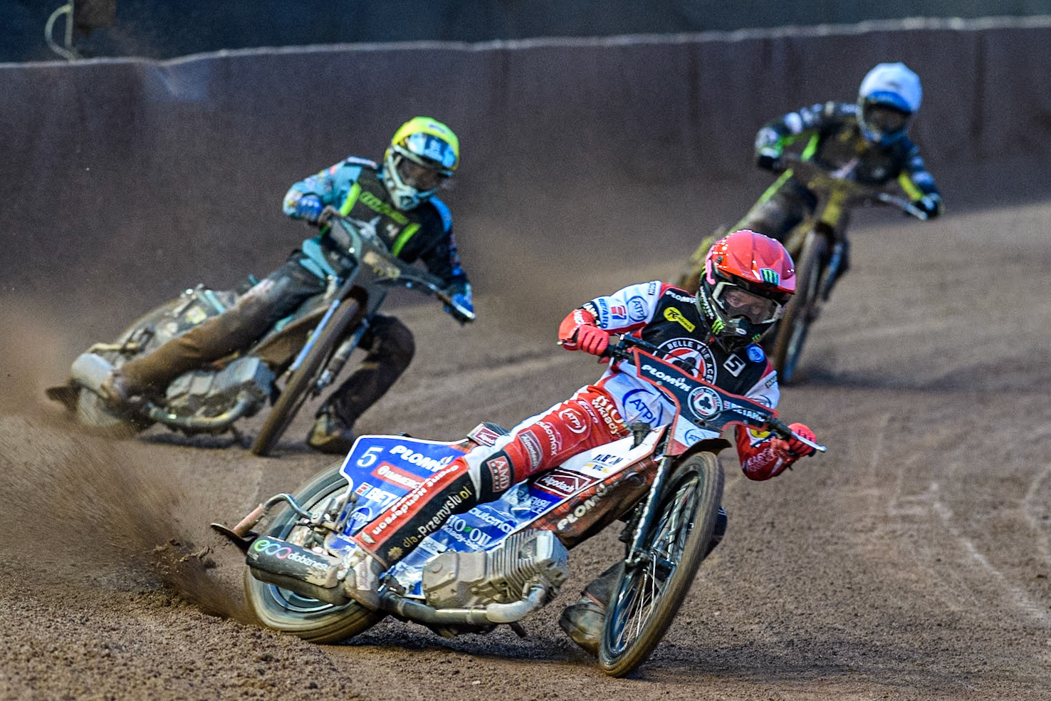Belle Vue Aces' Dan Bewley in Red leading Ipswich Witches' Guest Ryan Douglas in Yellow and Ipswich Witches' Adam Ellis in White during the Rowe Motor Oil Premiership match between Belle Vue Aces and Ipswich Witches at the National Speedway Stadium, Manchester on Monday 22nd April 2024. (Photo: Ian Charles | MI News)