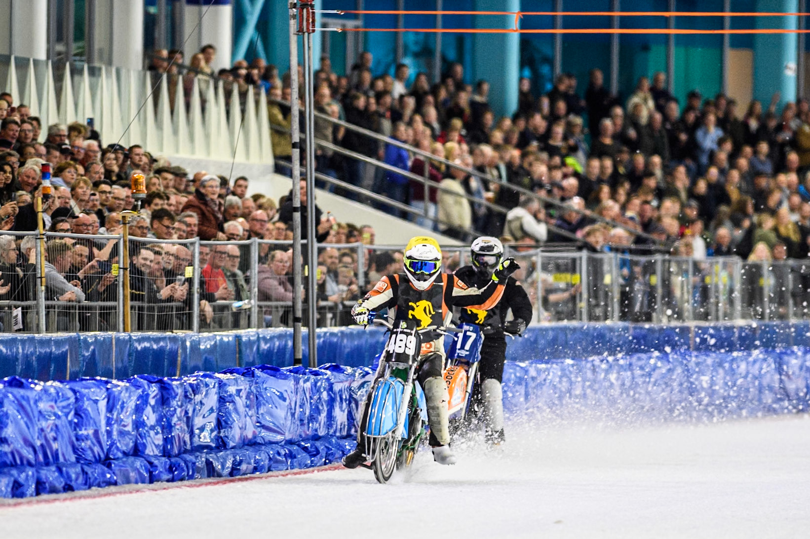 Melwin Björklin of Sweden in Yellow celebrates as he ins his first ever race in his first ever meeting ahead of Leon Kramer of The Netherlands in White during the Roelof Thijs Bokaal, Ice Rink Thialf, Heerenveen, Netherlands on Friday 4th April 2025. (Photo: Ian Charles | MI News)