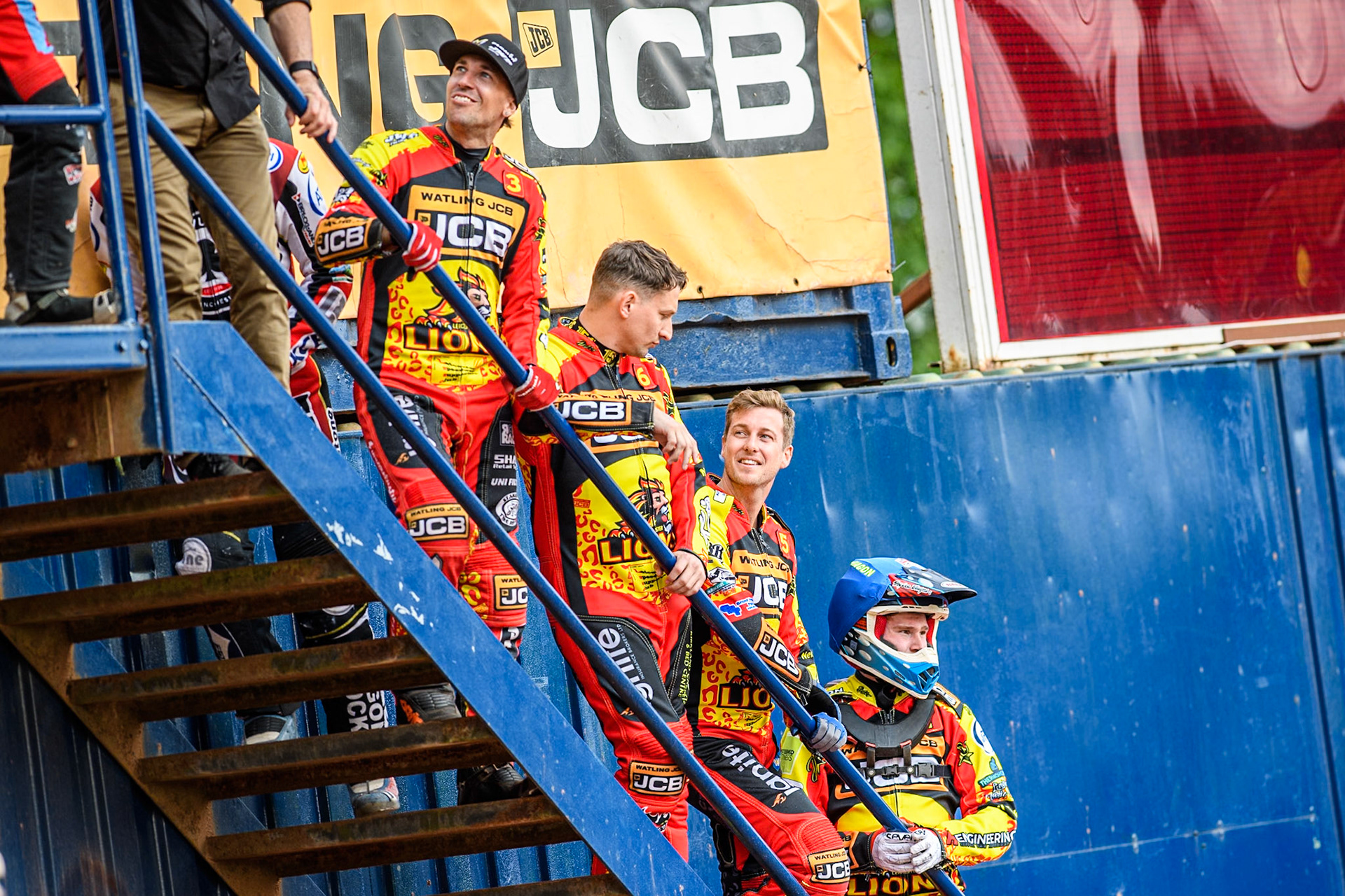 (L to R): Leicester Lions' riders Sam Masters, Craig Cook,  Ryan Douglas and Sam Hagon on the steps to watch the first heat during the Rowe Motor Oil Premiership match between Leicester Lions and Belle Vue Aces at the Pidcock Motorcycles Arena, Leicester on Thursday 25th July 2024. (Photo: Ian Charles | MI News)