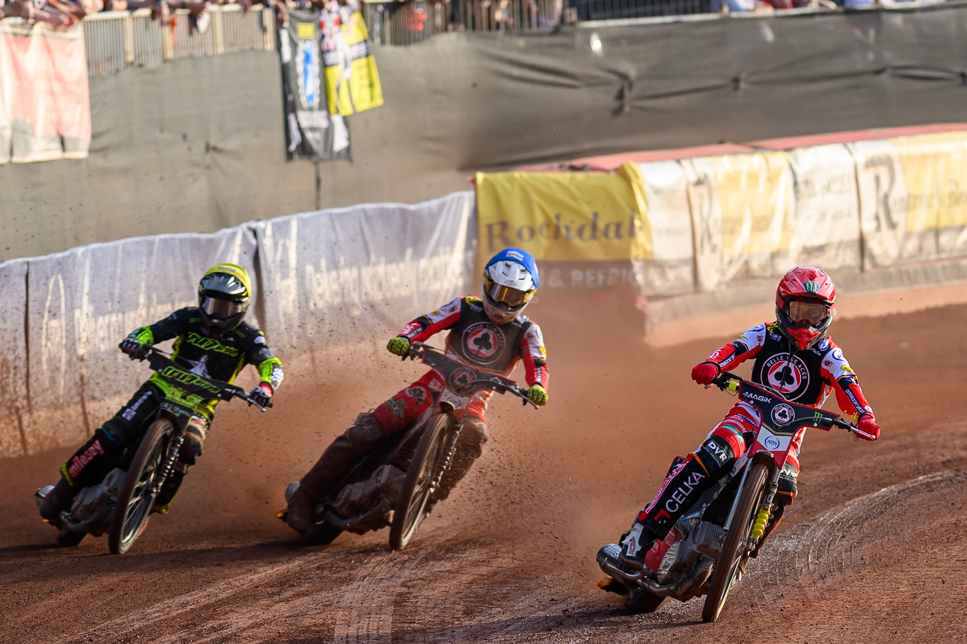 Belle Vue Aces' Jaimon Lidsey  in Red rides inside Belle Vue Aces' Zach Cook in Blue and Ipswich Witches' Danny King in Yellow during the Rowe Motor Oil Premiership match between Belle Vue Aces and Ipswich Witches at the National Speedway Stadium, Manchester on Monday 30th June 2025. (Photo: Ian Charles | MI News)