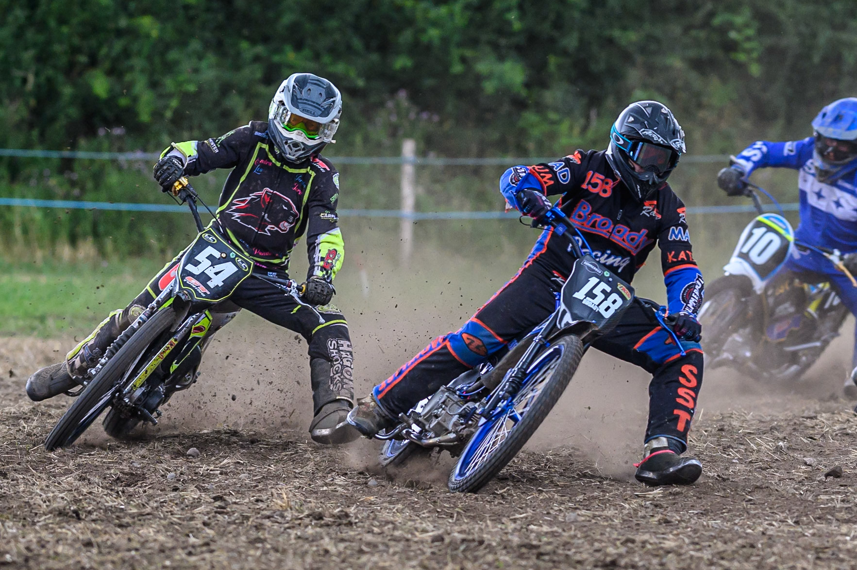 Wayne Broadhurst (158) leading Ian Clark (54) in the GT140 Class during the ACU Northern Grass Track Riders Championship at Cheshire Grass Track Club, Frog Lane, Knutsford, Cheshire on Sunday 20th July 2025. (Photo: Ian Charles | MI News)