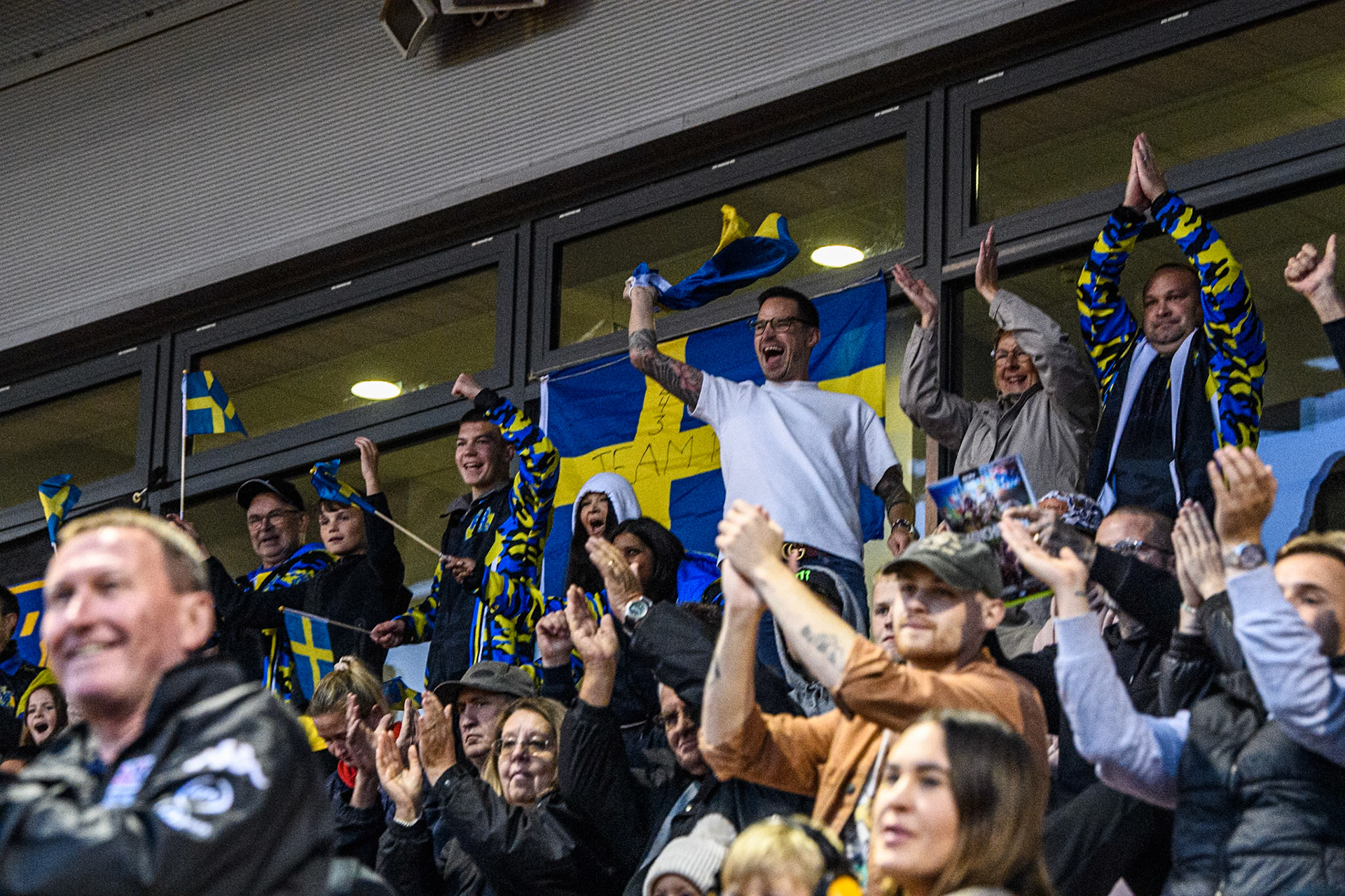 Swedish fans celebrate their team winning silver during the Monster Energy FIM Speedway of Nations 2 (Under 21) Final at the National Speedway Stadium, Manchester on Friday 12th July 2024. (Photo: Ian Charles | MI News)