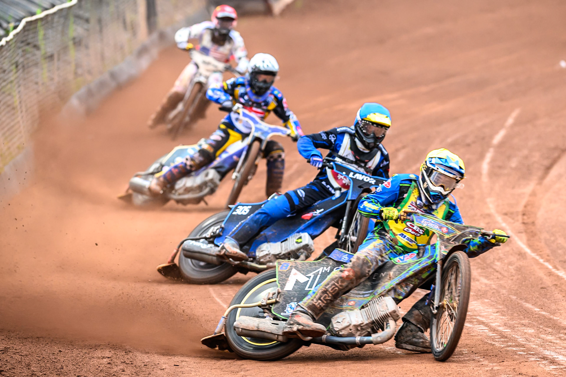 Michael West of Australia in Yellow leading Antoni Mencel of Poland in Blue, Joe Thompson of Great Britain in White and Slater Lightcap of The United States in Red during the FIM SGP2 Qualifying Round at the Peugeot Ashfield Stadium in Glasgow on Saturday 24th May 2025. (Photo: Ian Charles | MI News)