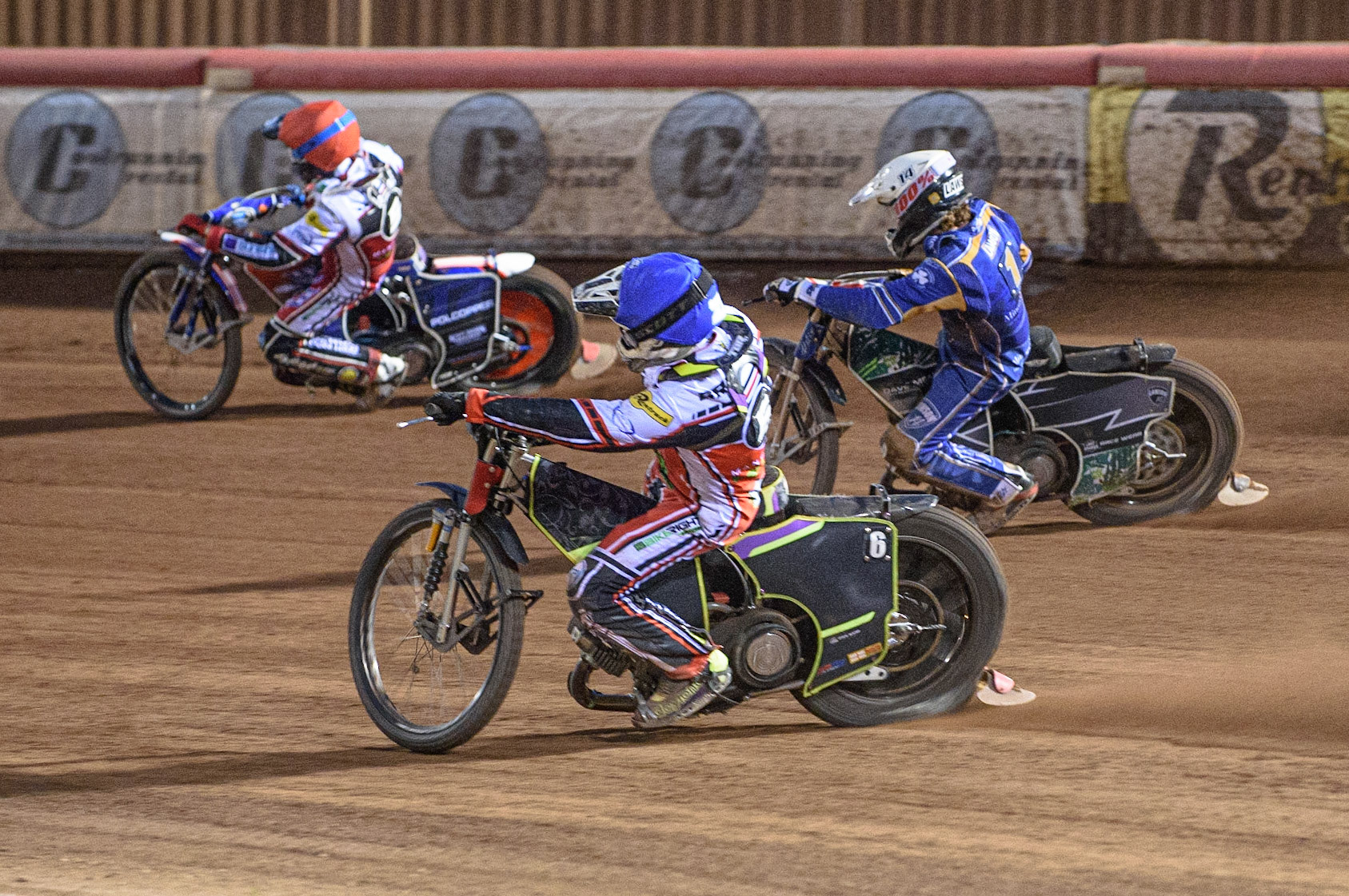 MANCHESTER, UK. AUGUST 23RD    Tom Brennan  (Blue) chases Richard Lawson  (White) and Brady Kurtz (Red) during the SGB Premiership match between Belle Vue Aces and King's Lynn Stars at the National Speedway Stadium, Manchester on Monday 23rd August 2021. (Credit: Ian Charles | MI News)