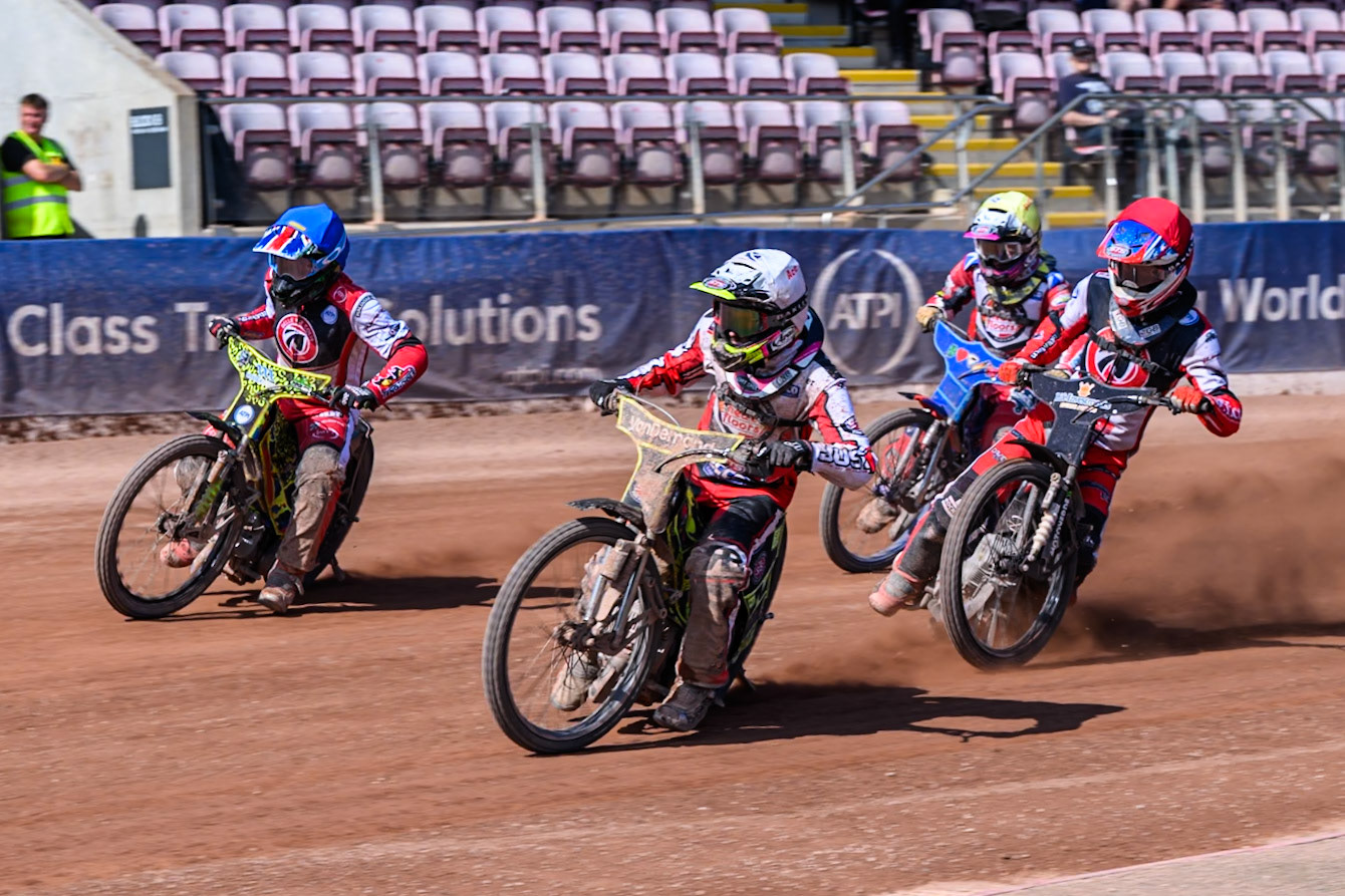 Ace Pijper of Middlesborough Tigers  in White leading William Cairns of Belle Vue Colts  in Blue, Freddy Hodder of Belle Vue Colts in Red and Stene Pijper of Middlesborough Tigers  in Yellow during the WSRA National Development League match between Belle Vue Colts and Middlesbrough Tigers at the National Speedway Stadium, Manchester on Sunday 10th August 2025. (Photo: Mark Fletcher | MI News)