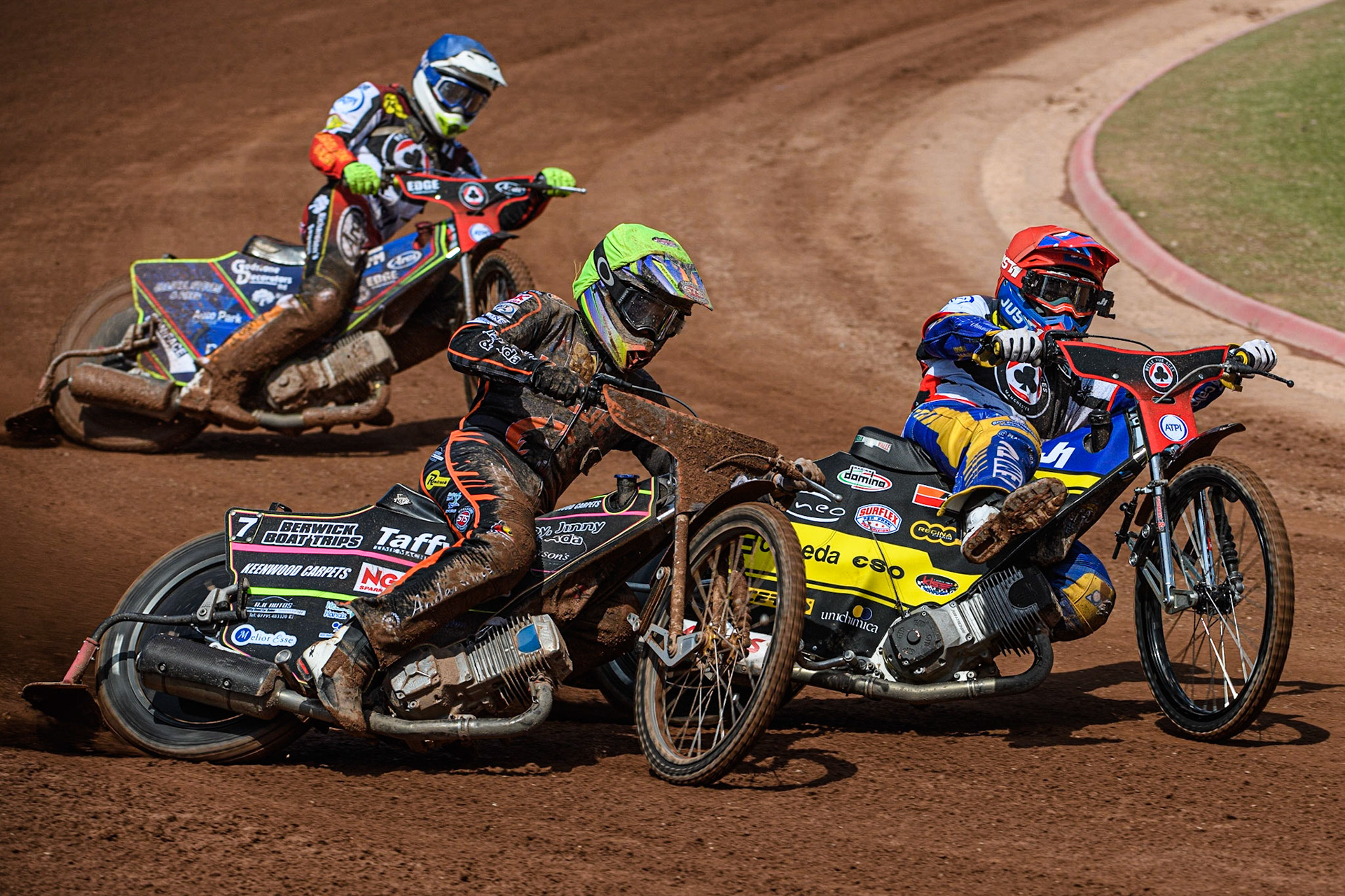 Paco Castagna (Red) inside Leon Flint (Yellow) with Jake Mulford (Blue) behind during the Sports Insure Premiership match between Belle Vue Aces and Wolverhampton Wolves at the National Speedway Stadium, Manchester on Monday 29th May 2023. (Photo: Ian Charles | MI News)