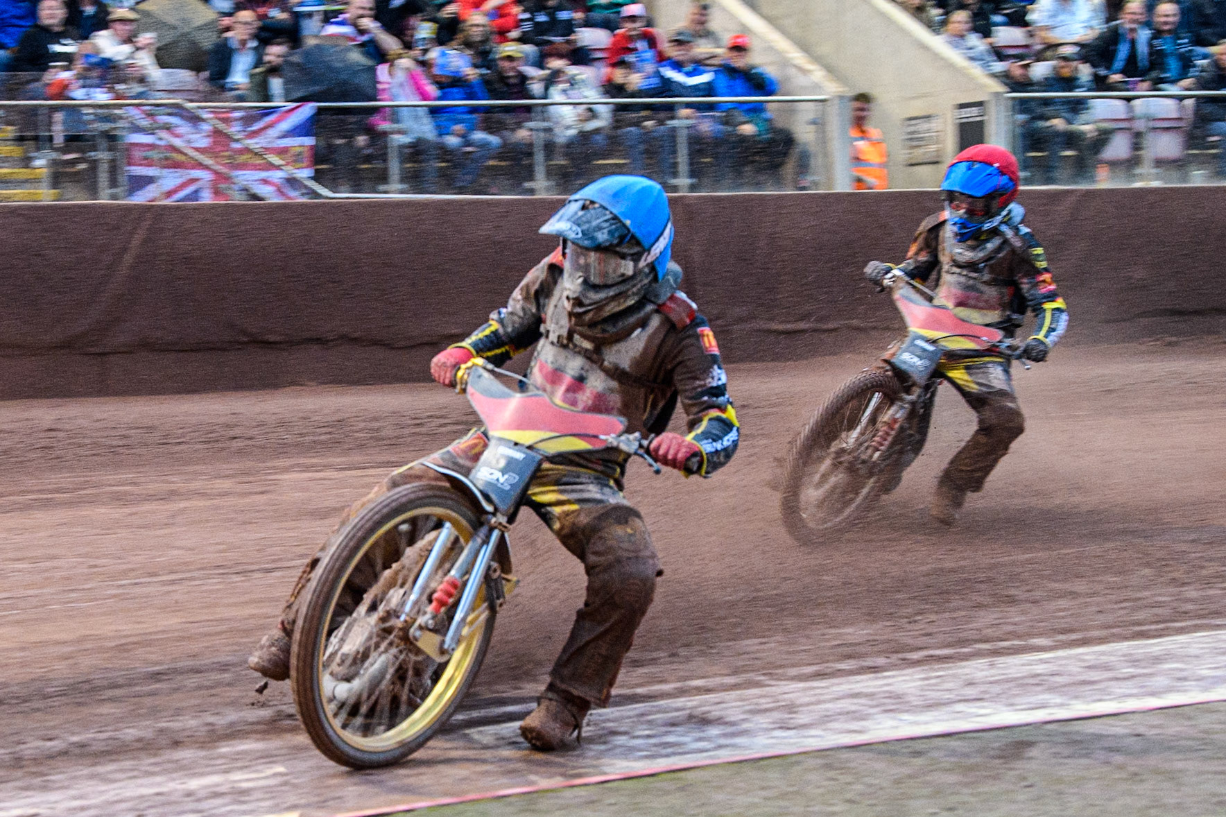 Norick Blödorn of Germany in Blue leading Jonny Wynant of Germany in Red during the Monster Energy FIM Speedway of Nations 2 (Under 21) Final at the National Speedway Stadium, Manchester on Friday 12th July 2024. (Photo: Ian Charles | MI News)
