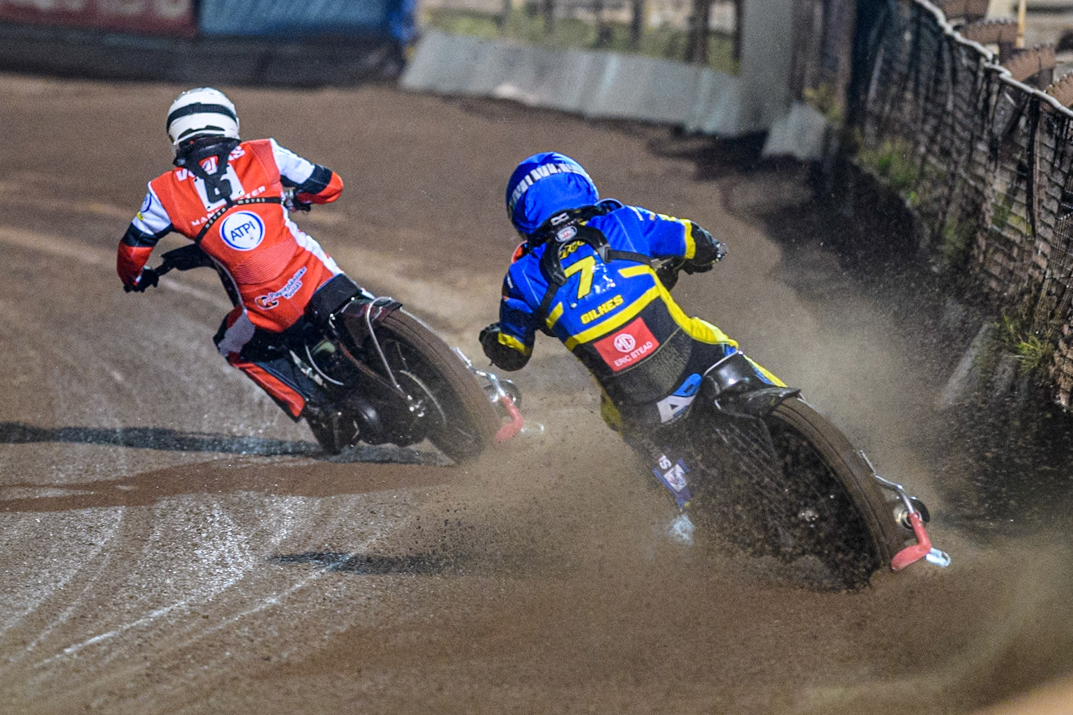 Sheffield Tigers' Dan Gilkes  in Blue chases Belle Vue Aces' Antti Vuolas  in White during the Rowe Motor Oil Premiership Play Off Semi Final 2nd leg between Sheffield Tigers and Belle Vue Aces at Owlerton Stadium, Sheffield on Thursday 19th September 2024. (Photo: Ian Charles | MI News)