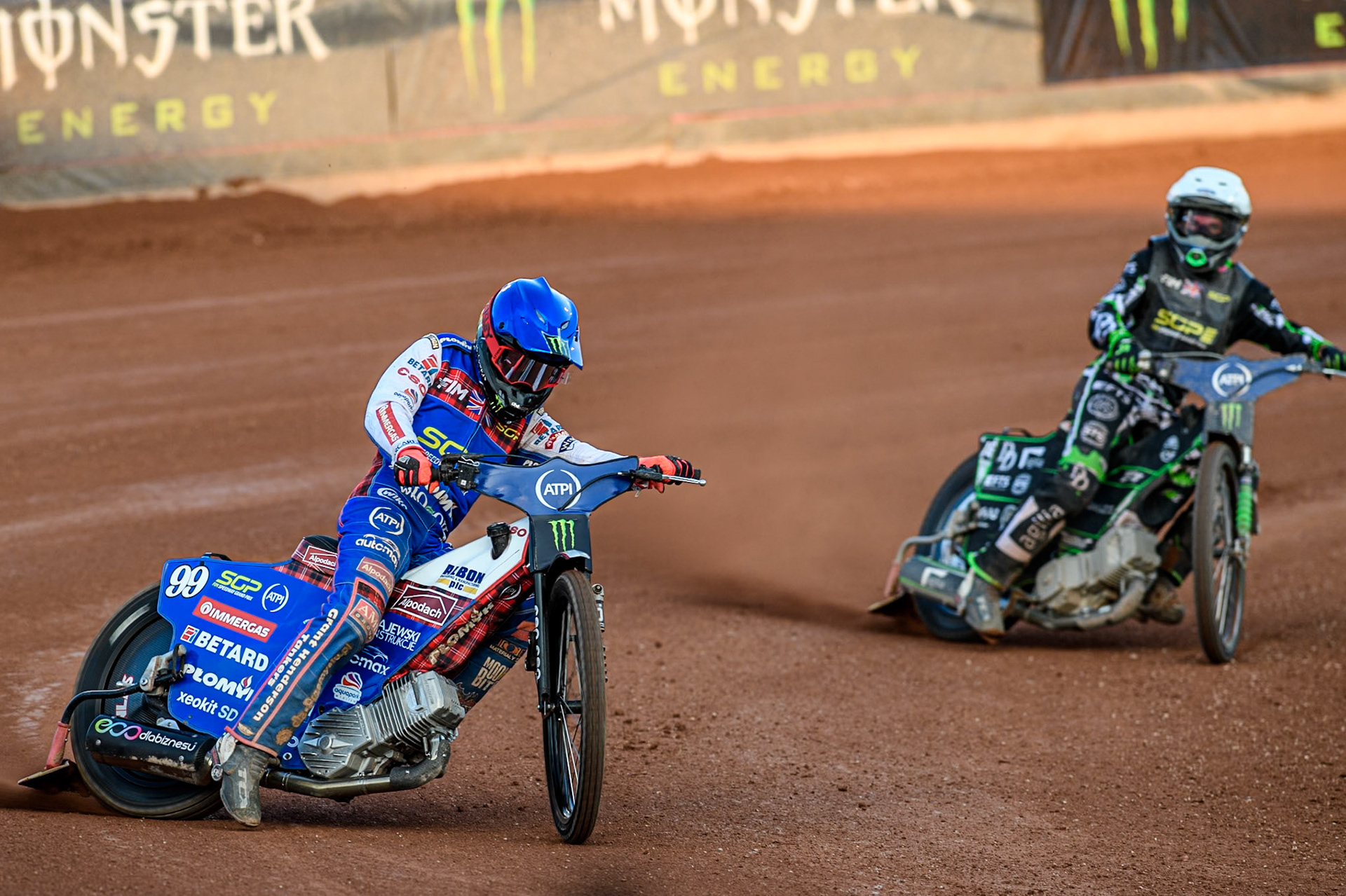 Dan Bewley (99) of Great Britain in Blue leading Wild Card Charles Wright (16) of Great Britain in White during the ATPI FIM Speedway Grand Prix Round 5 at the National Speedway Stadium, Manchester, on Saturday 14th June 2025. (Photo: Ian Charles | MI News)