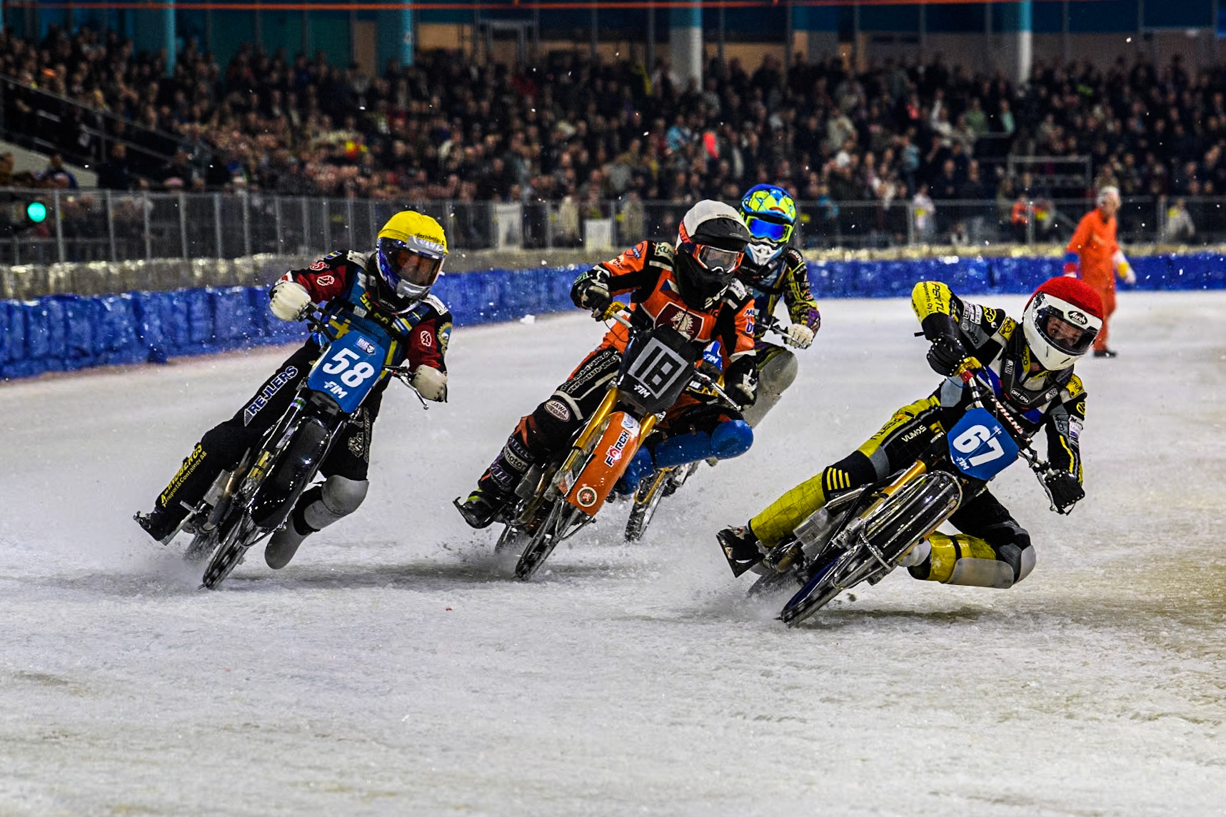 Finland's Heikki Huusko (67) in Red rides inside Reserve Czech Republic's Lukáš Hutla (18) in White and Sweden's Stefan Svensson (58) in Blue with 16\ in Blue behind during the FIM Ice Speedway Gladiators World Championship Final 3 at Ice Rink Thialf, Heerenveen on Saturday 6th April 2024. (Photo: Ian Charles | MI News)